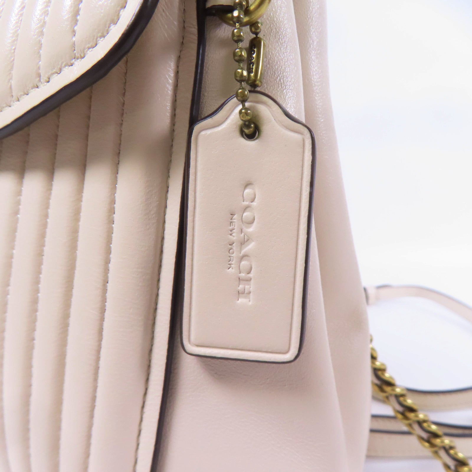 COACH 牛皮皮革Rucksack金扣鏈帶背包