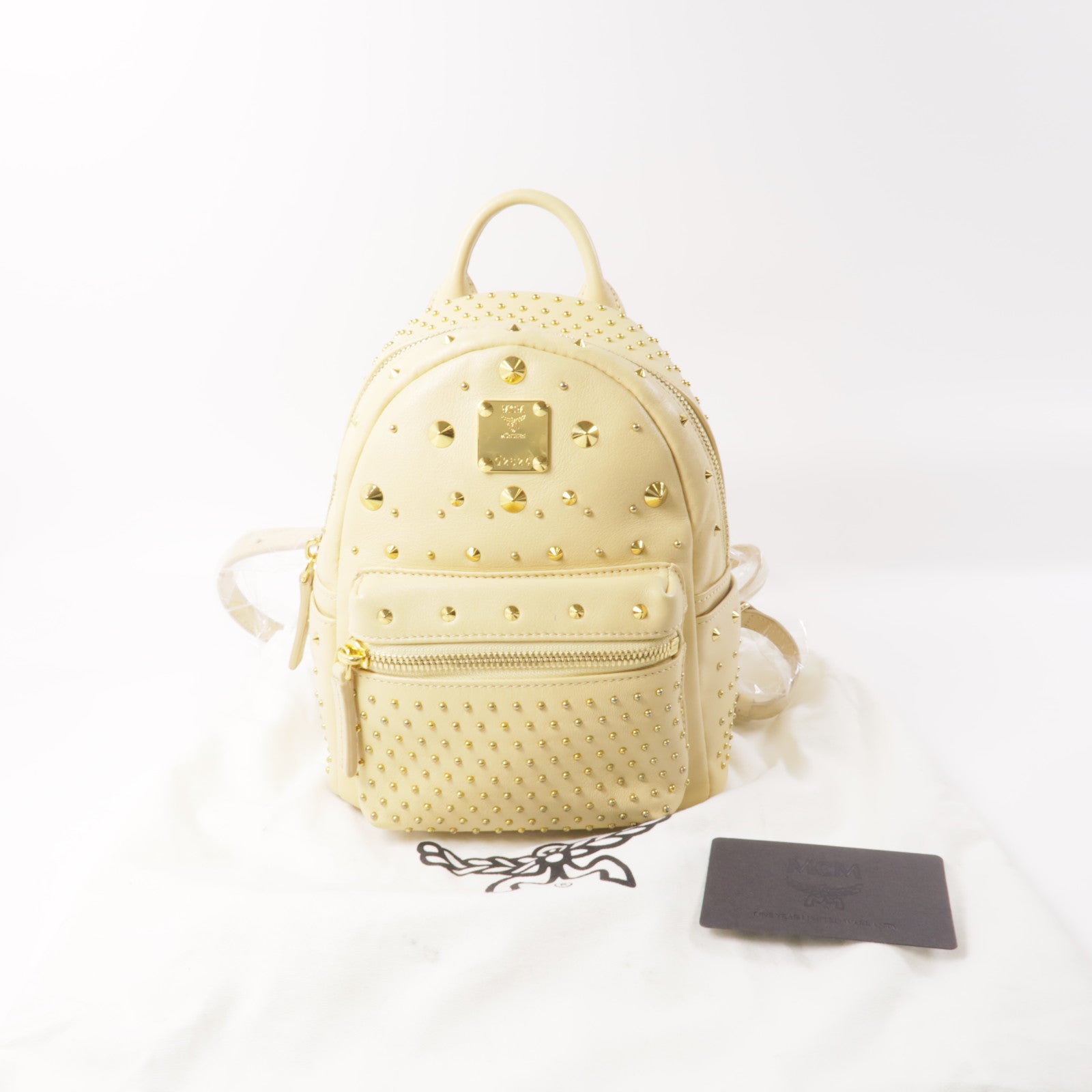 MCM 牛皮皮革Backpack金扣背包米色