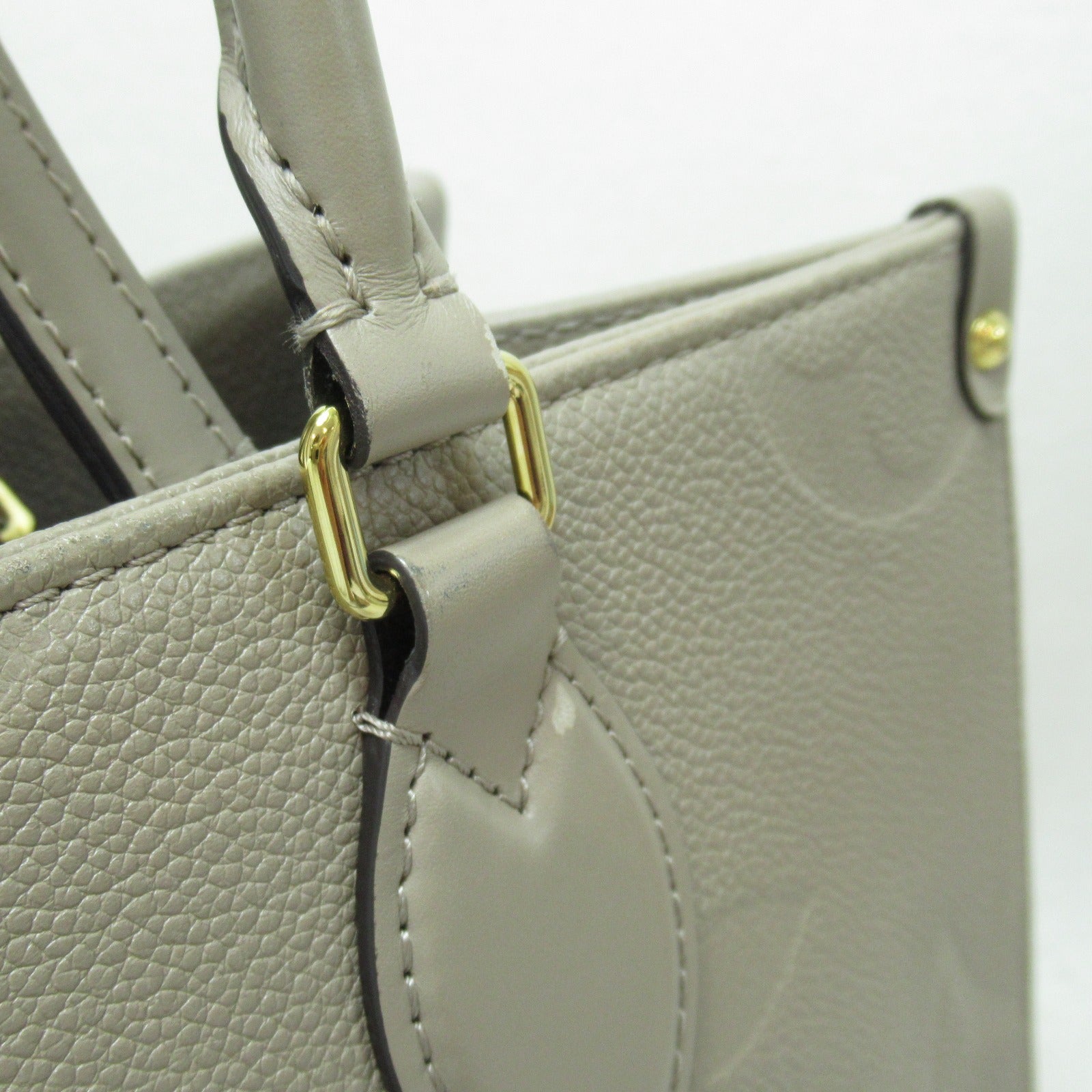 LOUIS VUITTON Monogram Empreinte OnTheGo MM金扣手挽肩背兩用袋米色