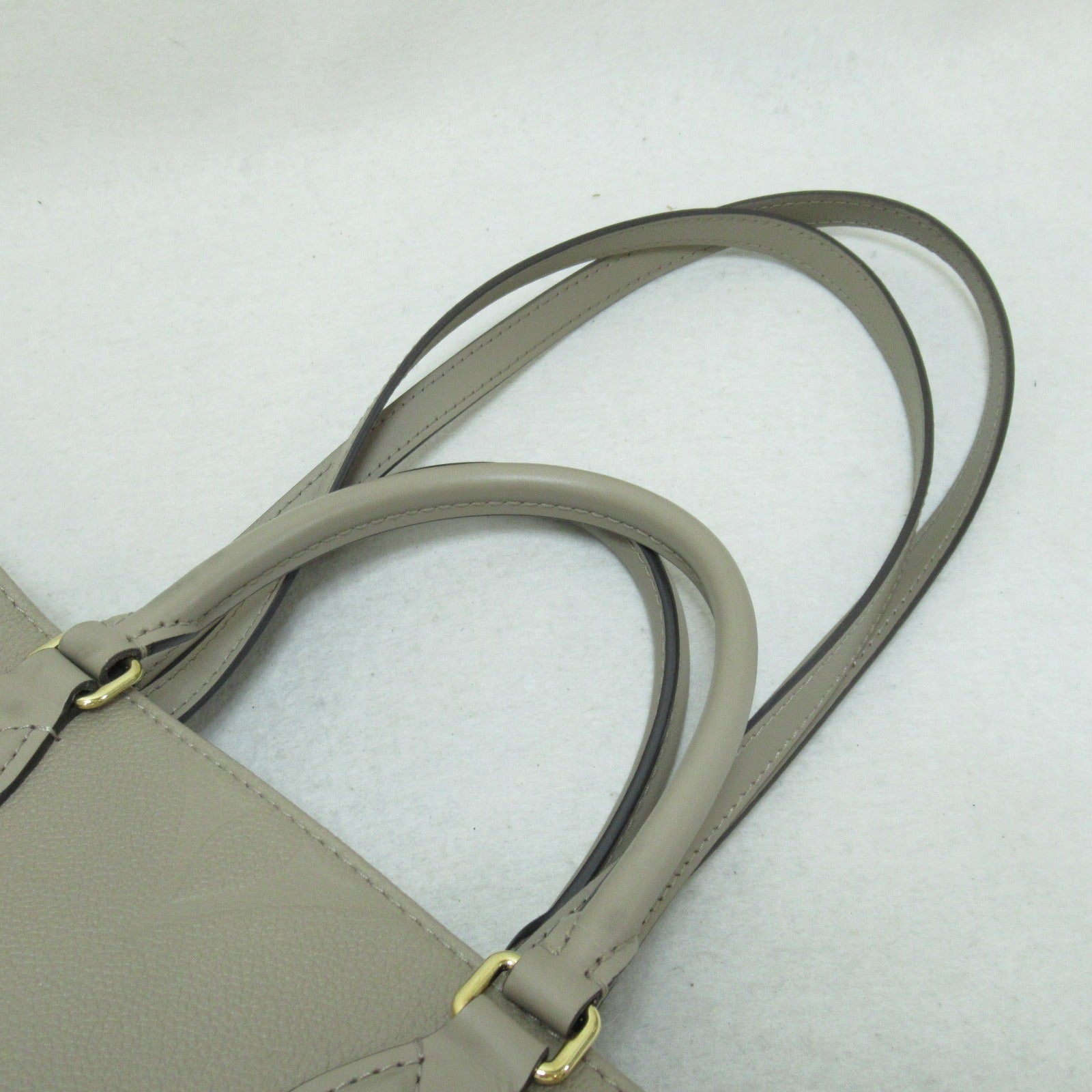 LOUIS VUITTON Monogram Empreinte OnTheGo MM金扣手挽肩背兩用袋米色