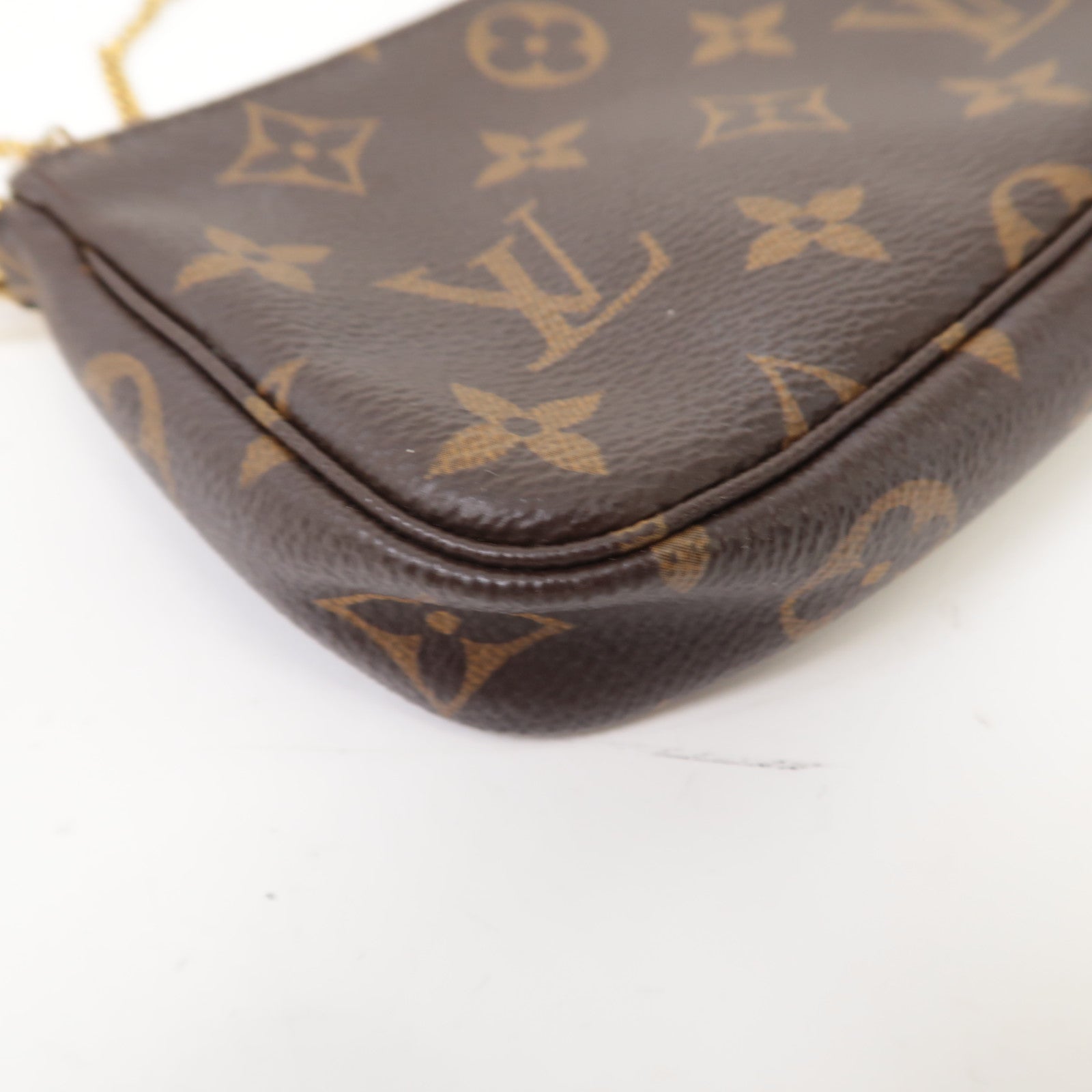 LOUIS VUITTON Monogram Mini Pochette Accessoires金扣手挽袋啡色