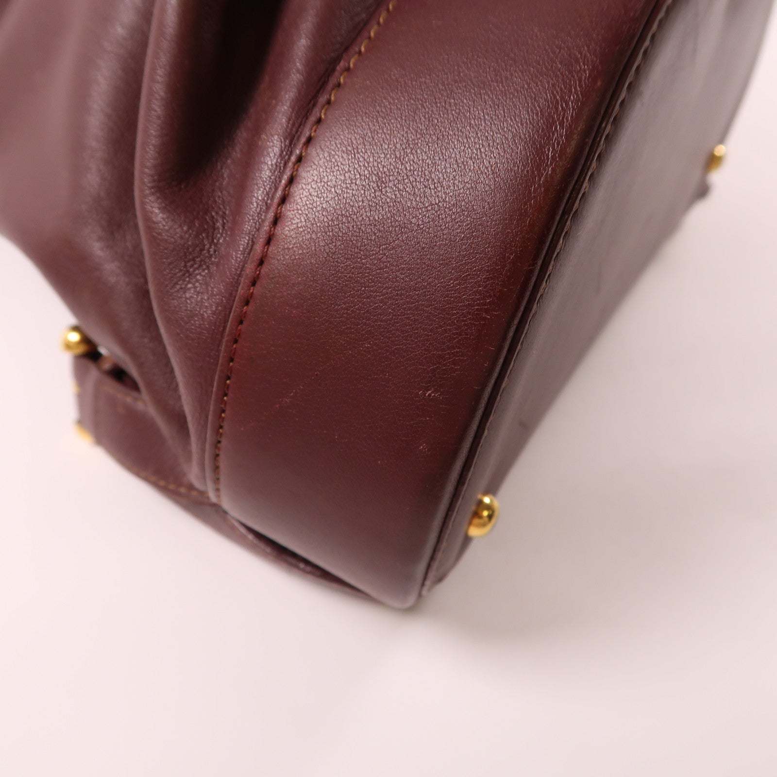 LOEWE 牛皮皮革Backpack金扣背包酒紅色