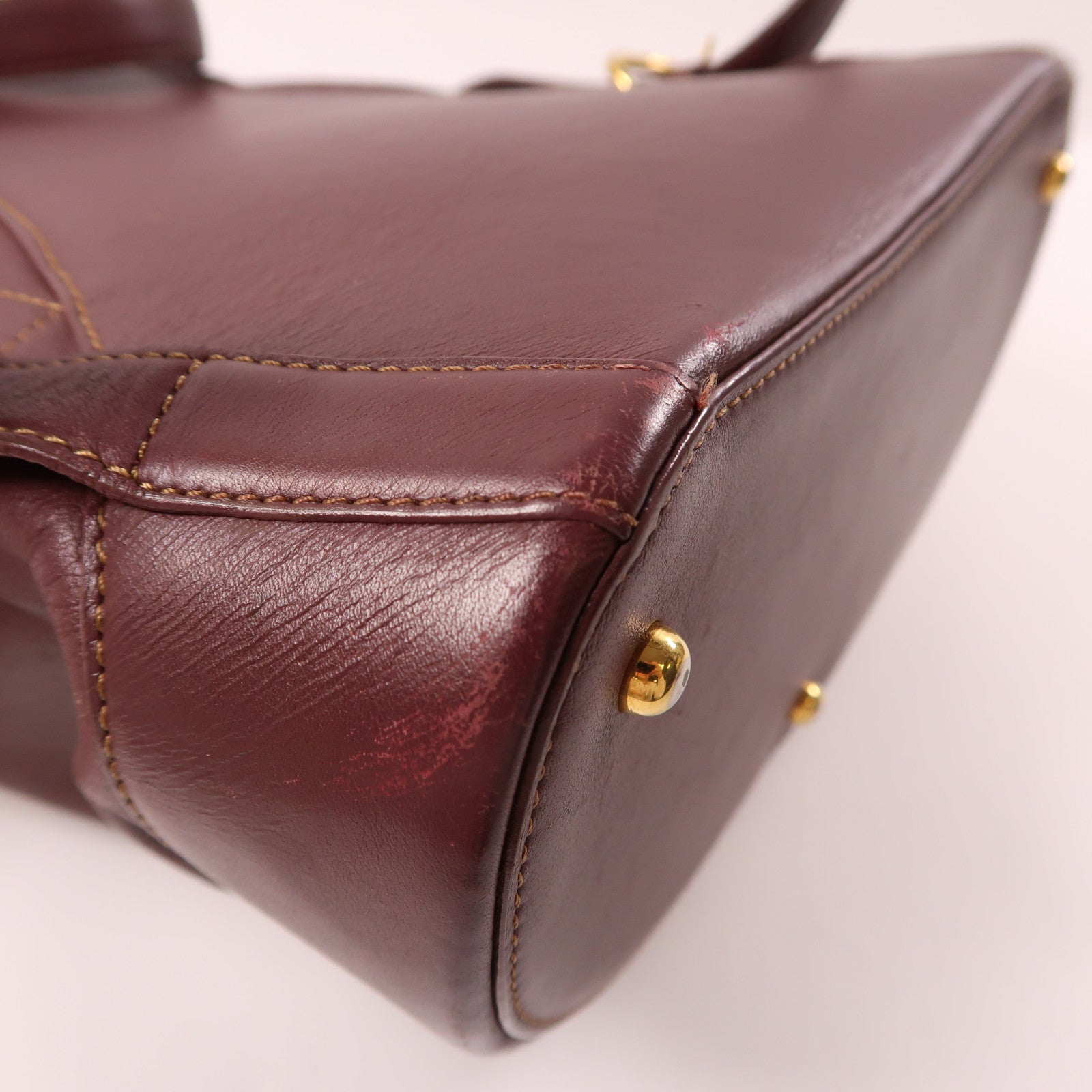LOEWE 牛皮皮革Backpack金扣背包酒紅色