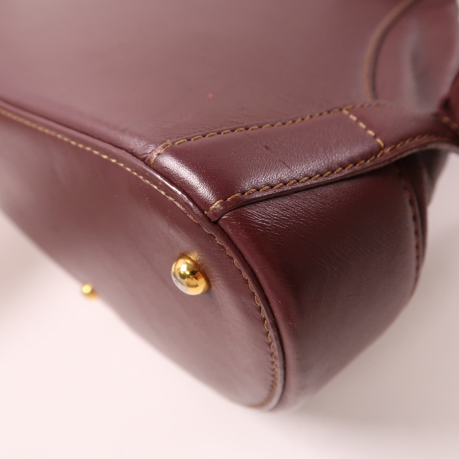 LOEWE 牛皮皮革Backpack金扣背包酒紅色
