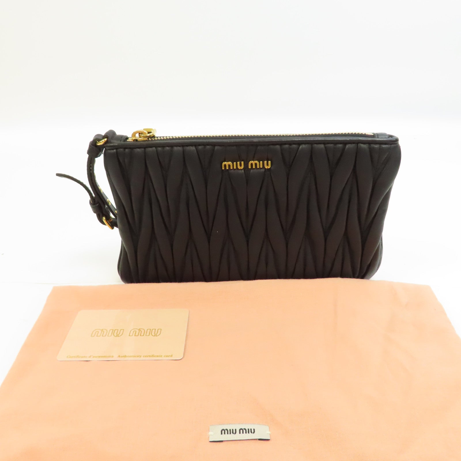 Miu Miu 羊皮皮革Clutch Bag金扣手拿包黑色