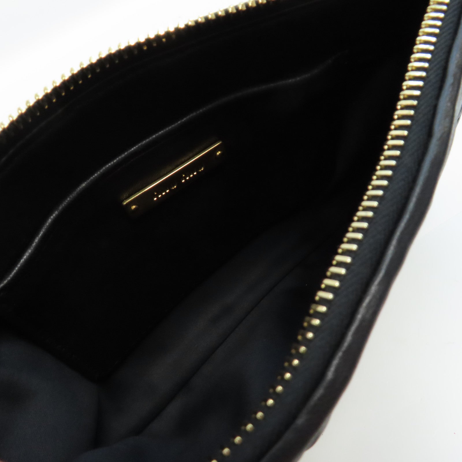Miu Miu 羊皮皮革Clutch Bag金扣手拿包黑色