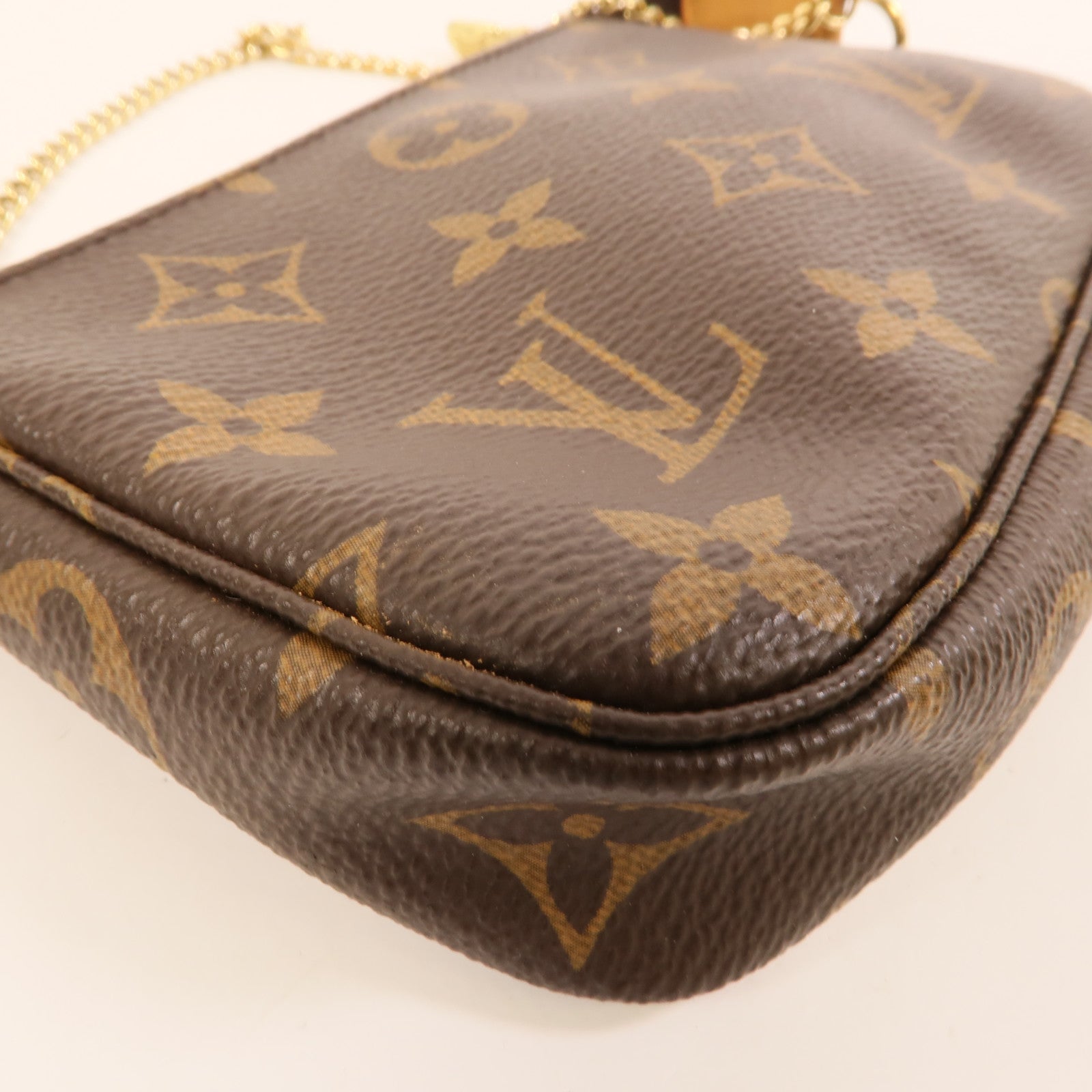 LOUIS VUITTON Monogram Mini Pochette Accessoires金扣手挽袋