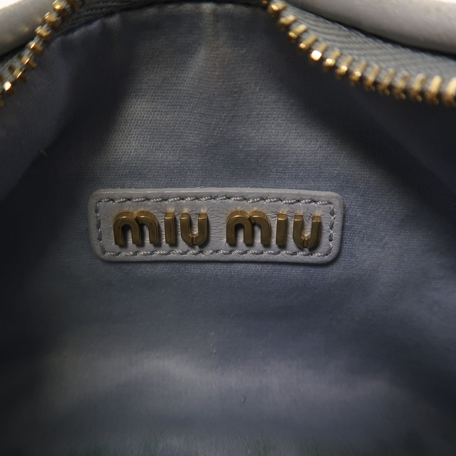 Miu Miu 羊皮皮革Wander Matelasse XS金扣手挽肩背兩用袋藍色