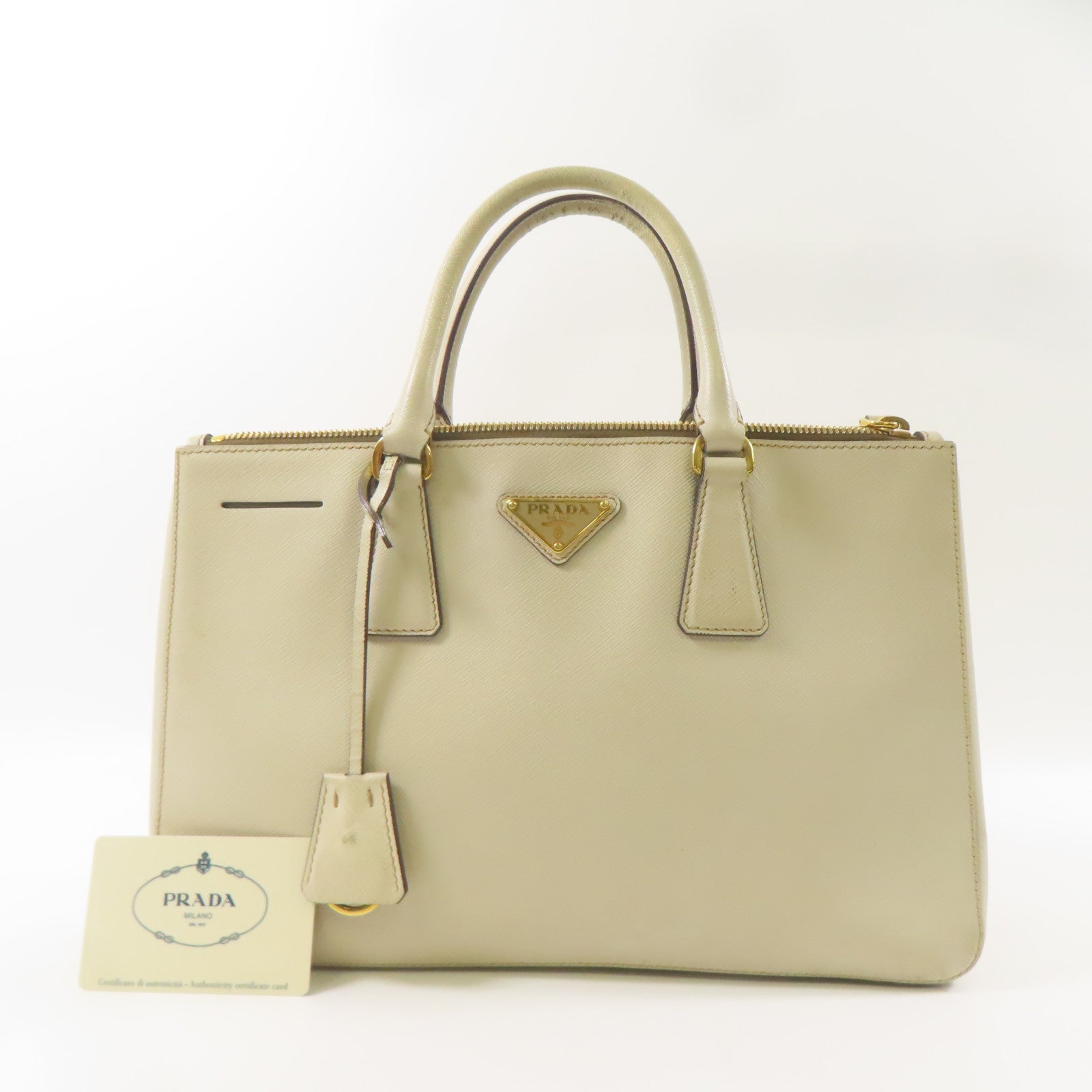 PRADA 牛皮皮革Saffiano金扣手挽袋米白色