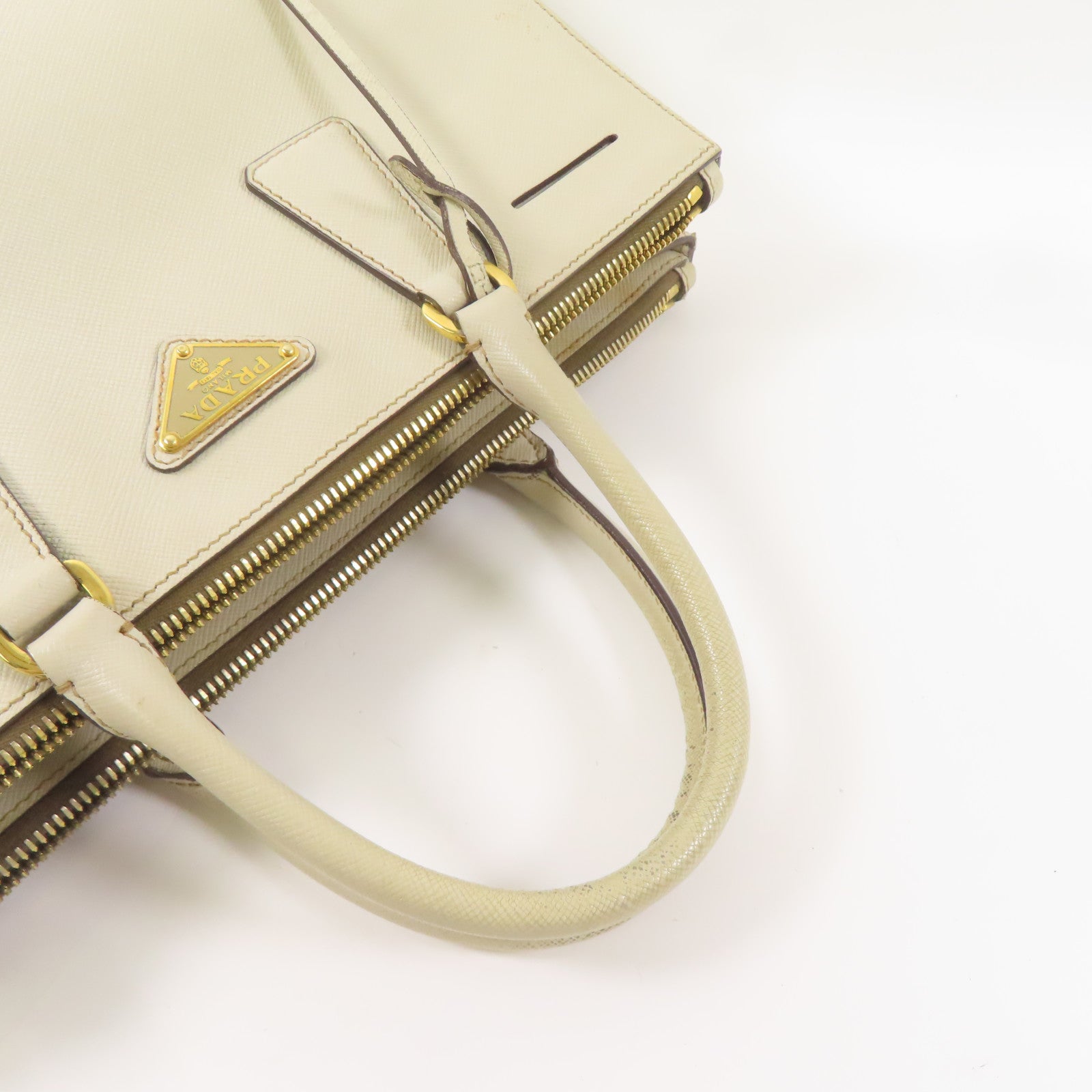 PRADA 牛皮皮革Saffiano金扣手挽袋米白色