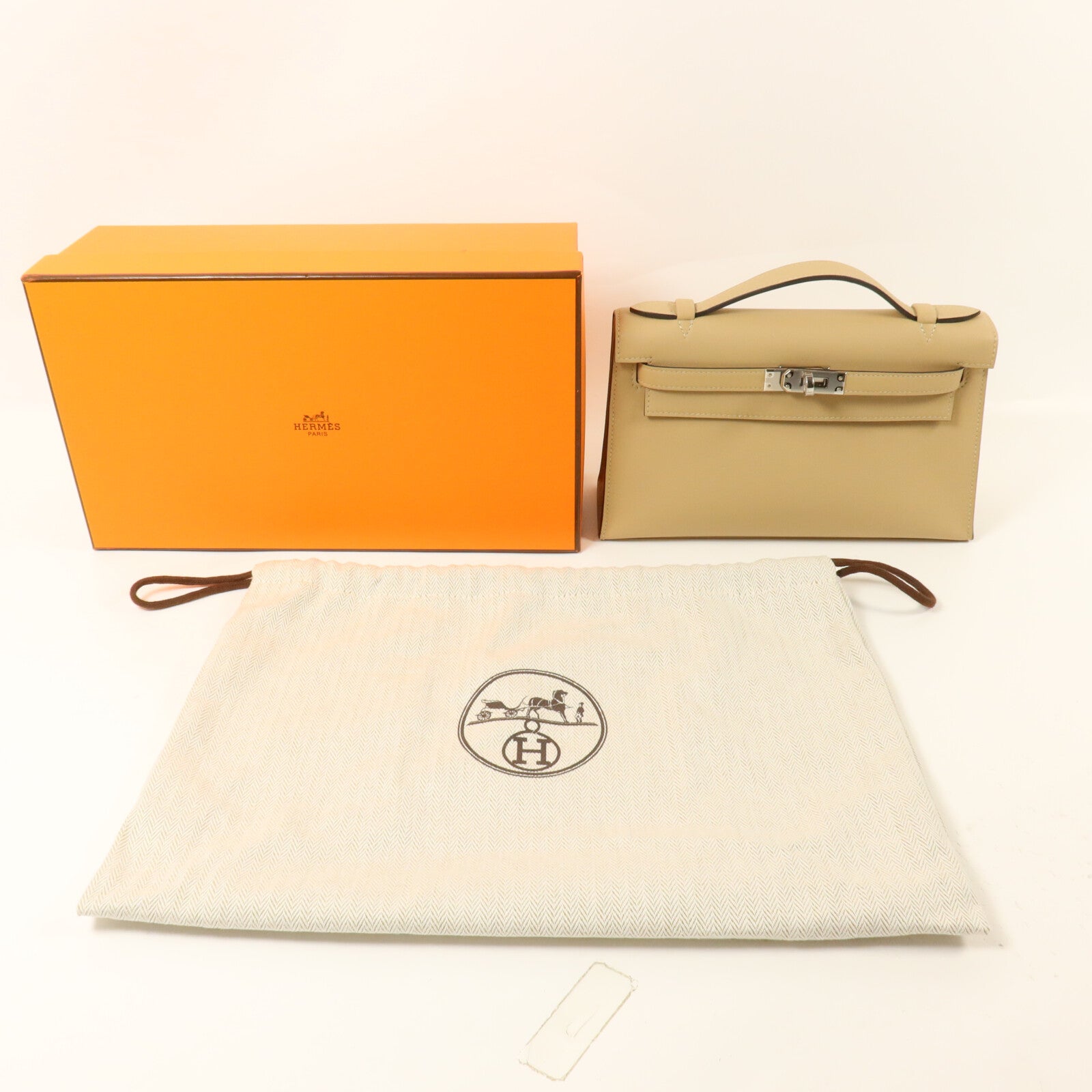 HERMES Swift皮革Kelly Pochette手挽袋Trench