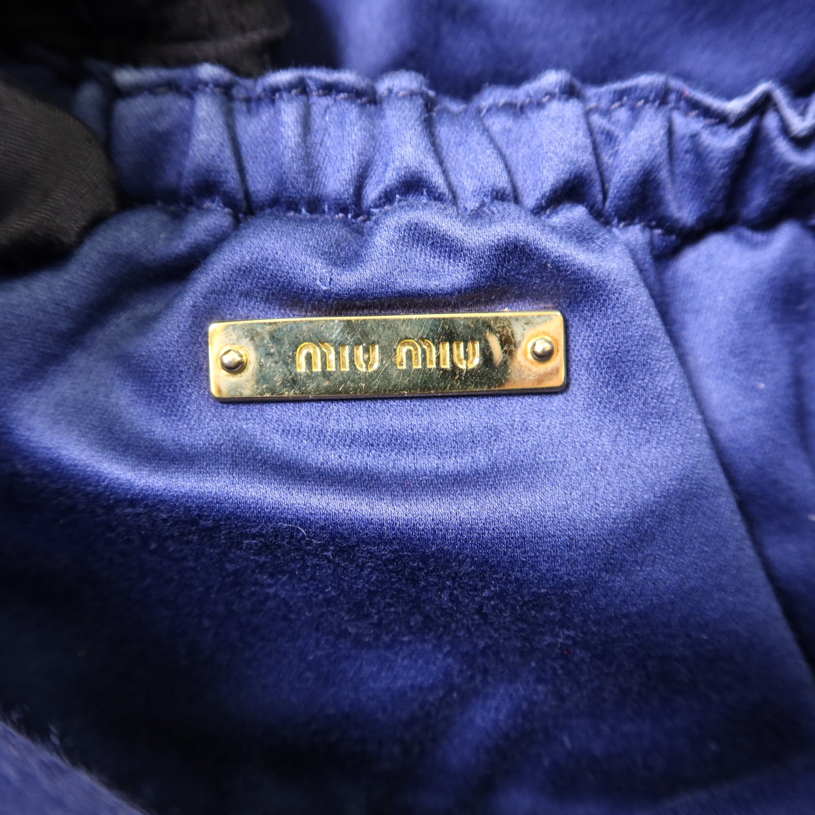 Miu Miu 牛皮皮革Clutch Bag金扣手拿包