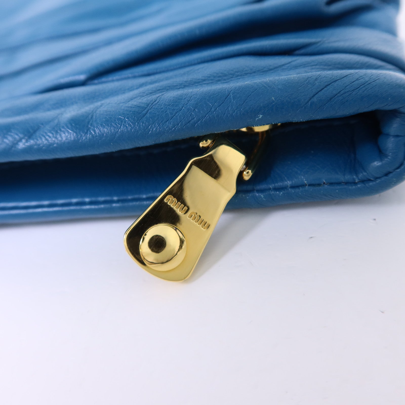 Miu Miu 牛皮皮革Clutch Bag金扣手拿包