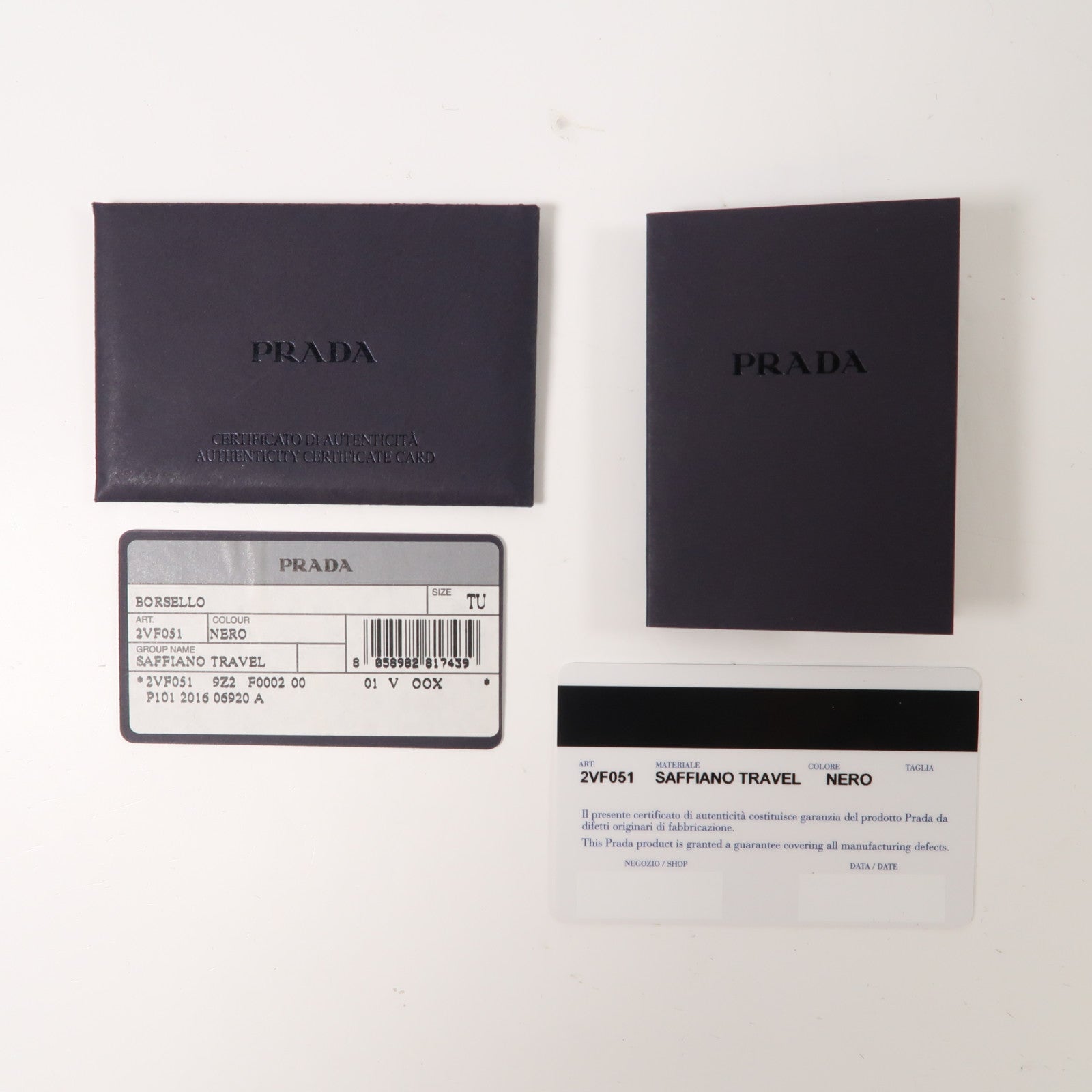 PRADA 牛皮皮革Saffiano Travel銀扣手拿包黑色