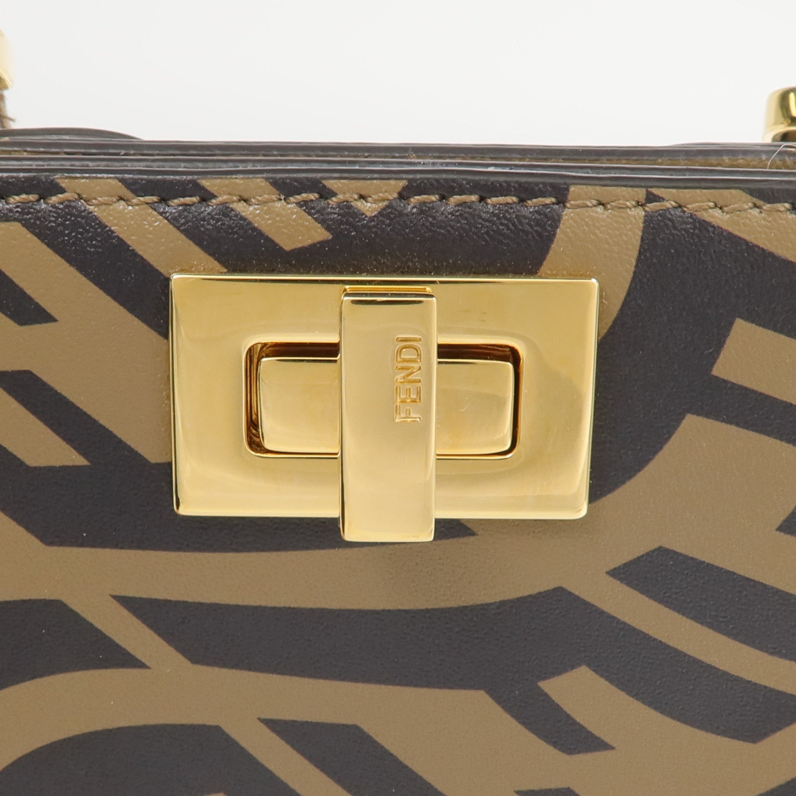FENDI 牛皮皮革/塗層帆布Fendi Sarah Coleman Vertigo Peek-a-Phone手機袋