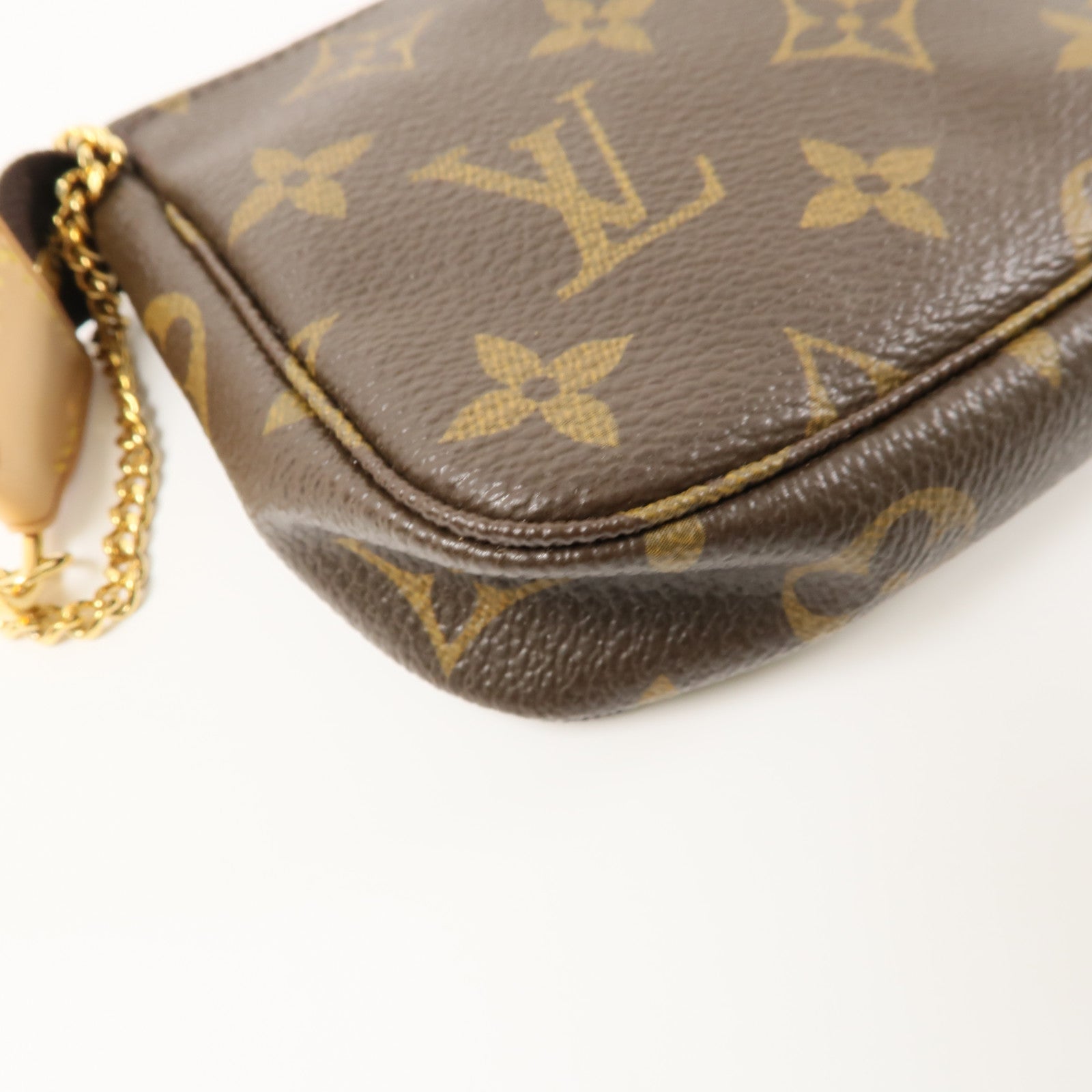 LOUIS VUITTON Monogram Mini Pochette Accessoires金扣手挽袋棕色