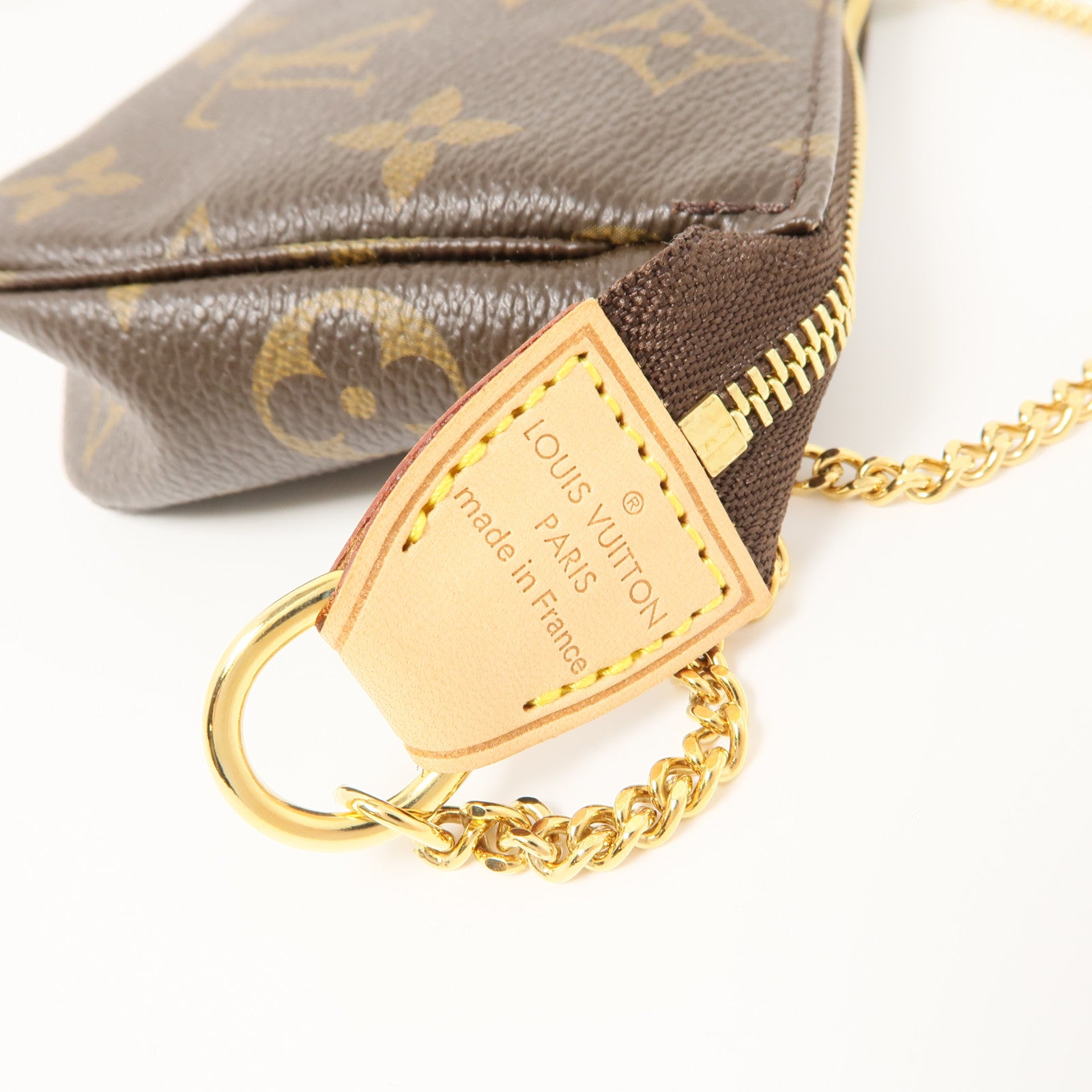 LOUIS VUITTON Monogram Mini Pochette Accessoires金扣手挽袋棕色