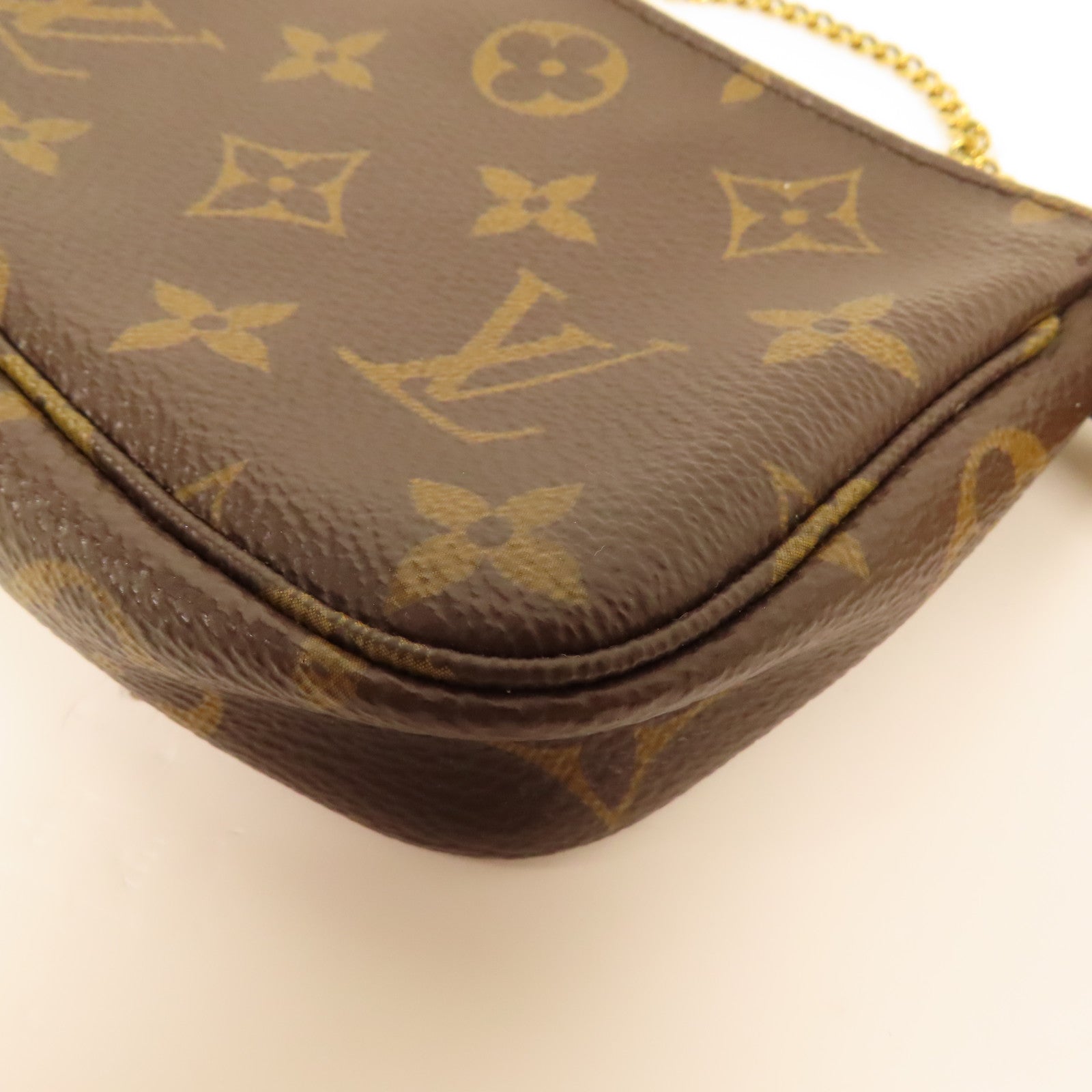 LOUIS VUITTON Monogram Mini Pochette Accessoires金扣手挽袋