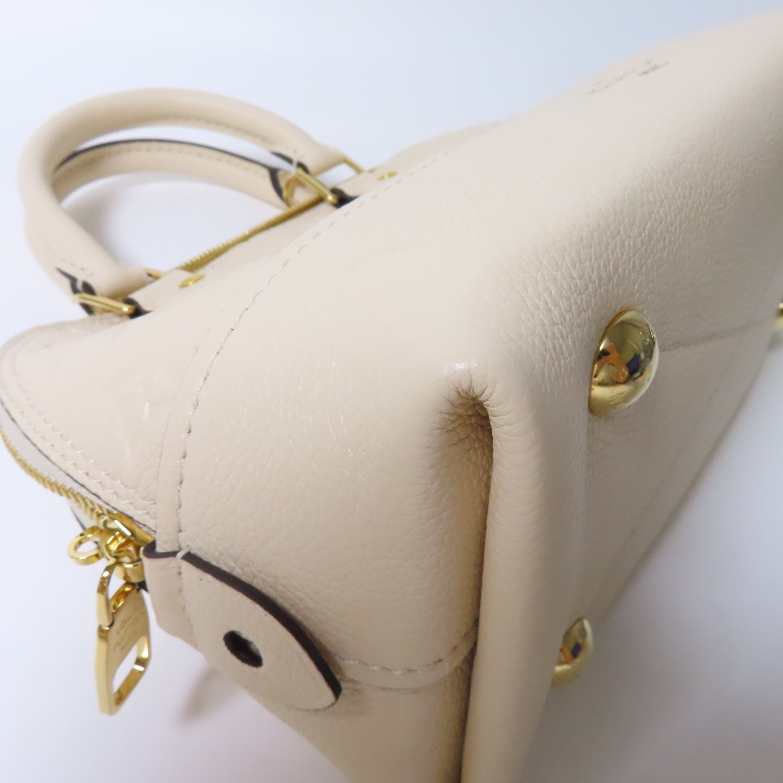 LOUIS VUITTON Monogram Empreinte Neo Alma BB金扣手挽肩背兩用袋米色