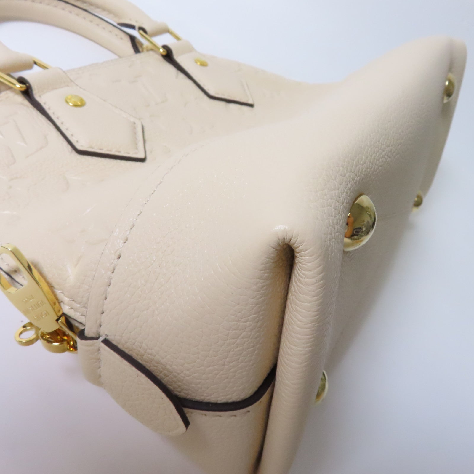 LOUIS VUITTON Monogram Empreinte Neo Alma BB金扣手挽肩背兩用袋米色
