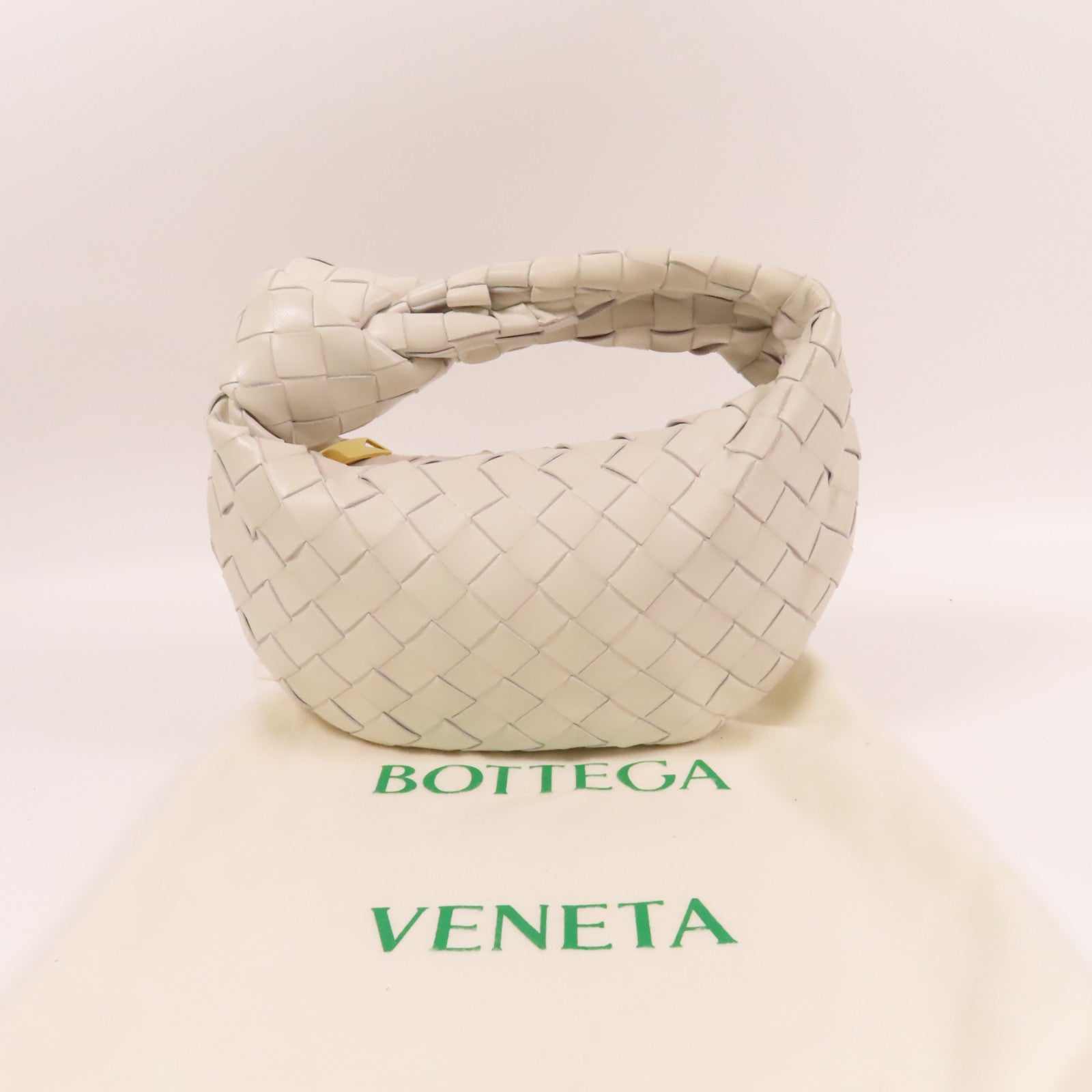 BOTTEGA VENETA 羊皮皮革Mini Jodie金扣手挽袋白色