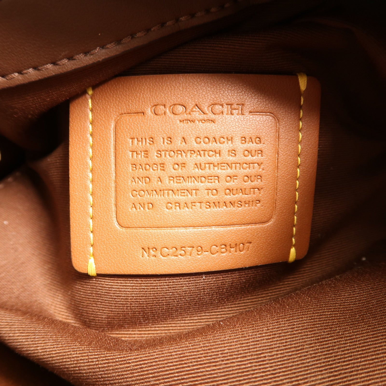COACH 塗層帆布Bucket Bag金扣肩背袋