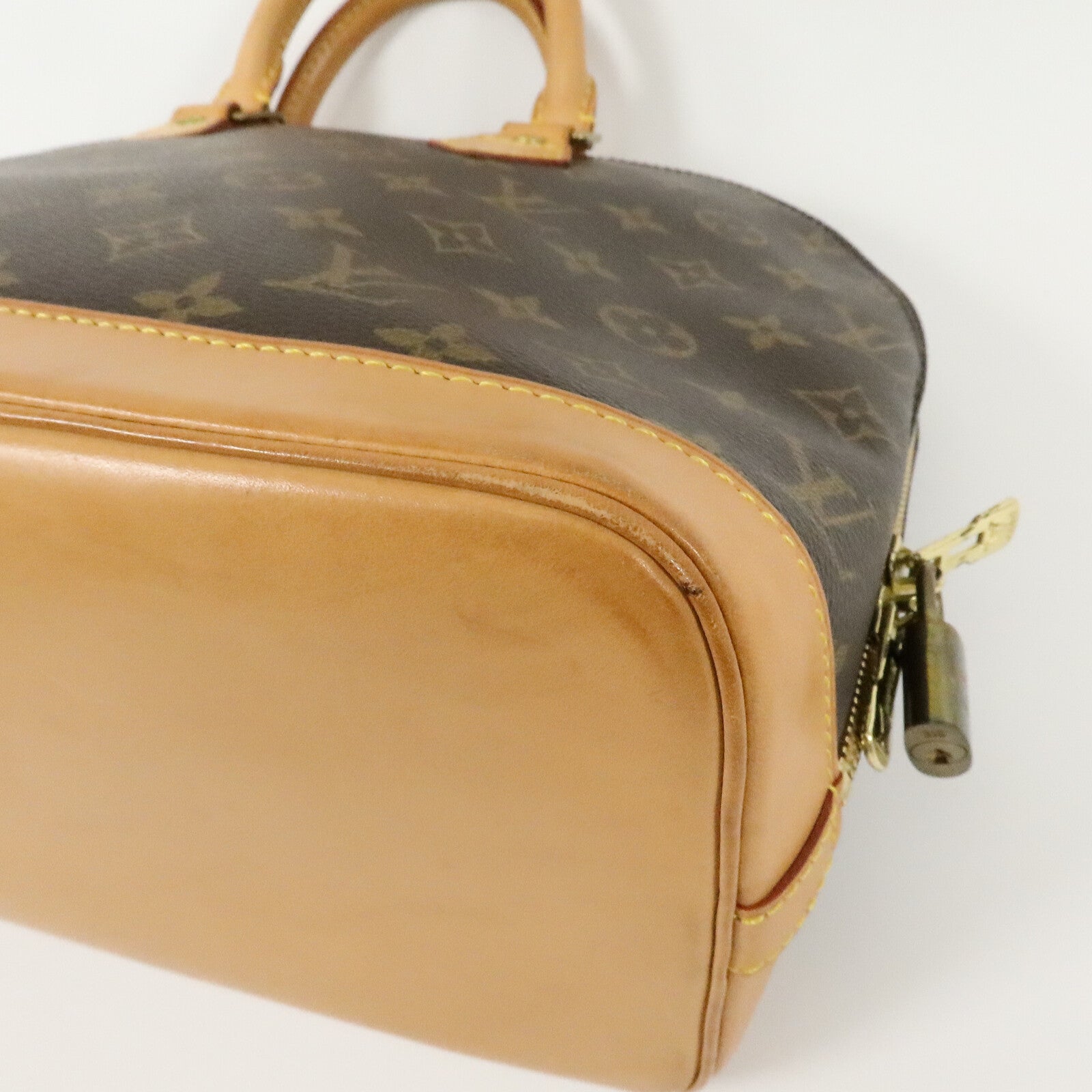 LOUIS VUITTON Monogram Alma金扣手挽袋棕色