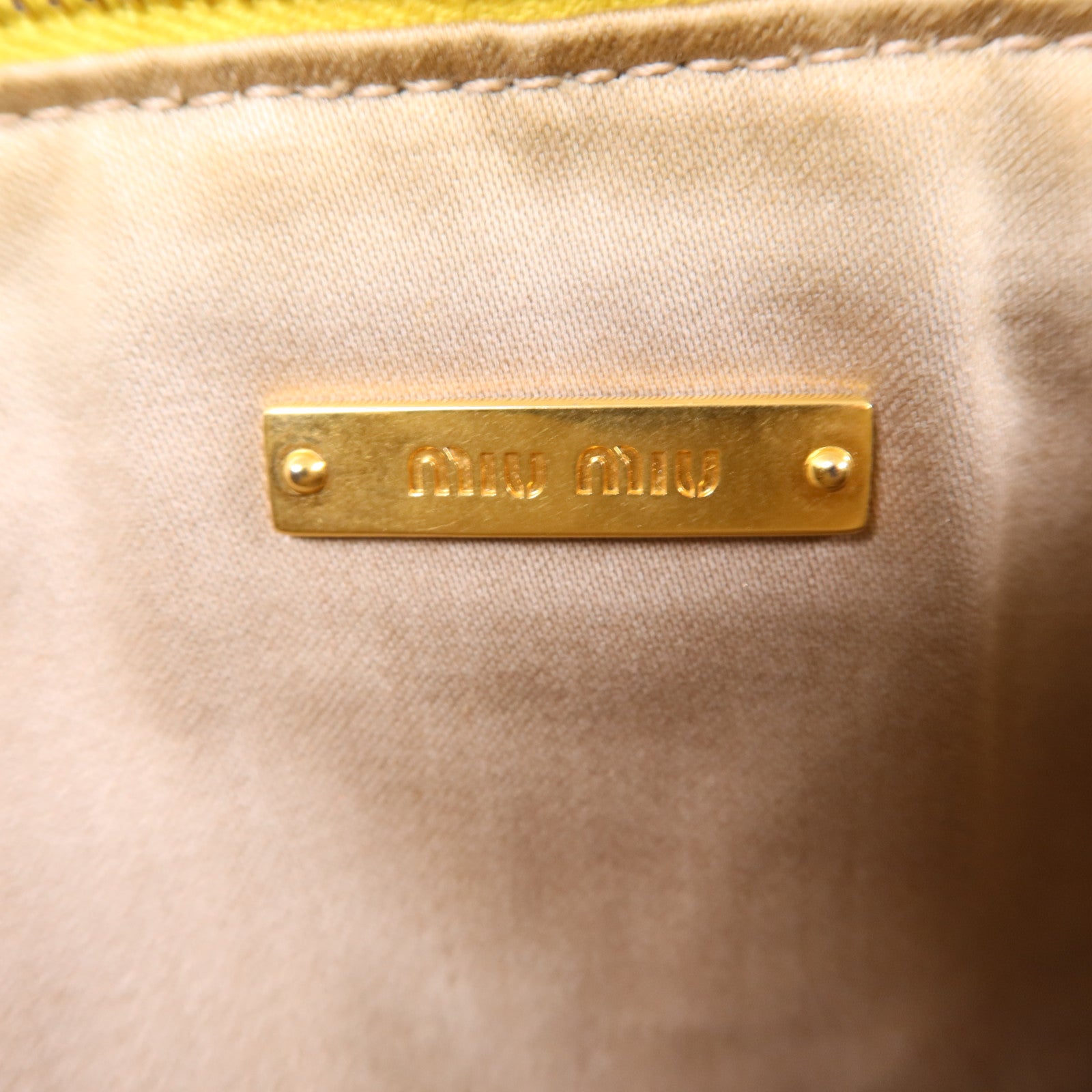 Miu Miu 牛皮皮革Clutch Bag金扣手拿包