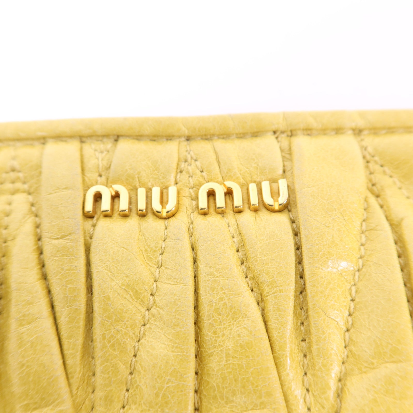 Miu Miu 牛皮皮革Clutch Bag金扣手拿包