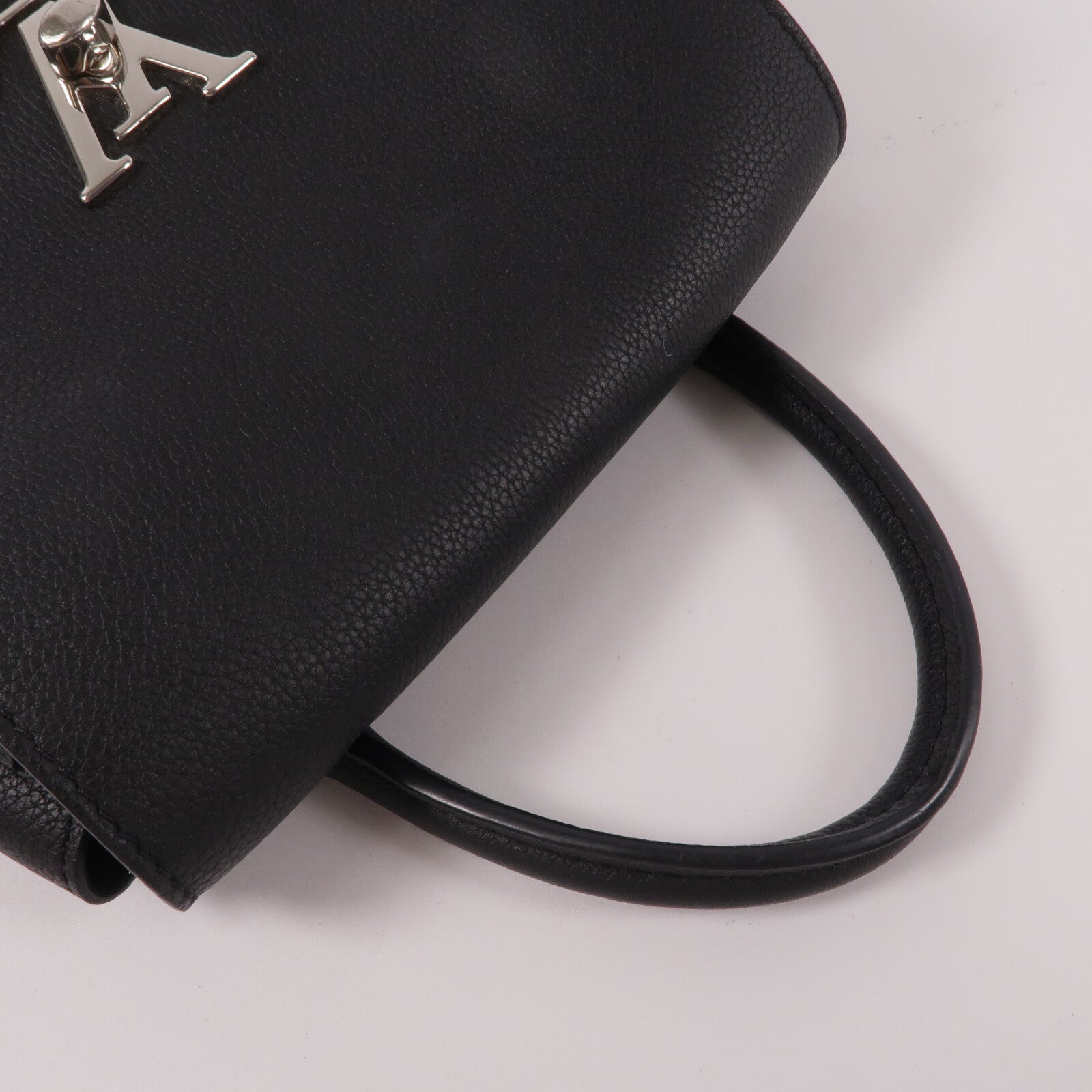 LOUIS VUITTON 牛皮皮革Lock Me Backpack背包