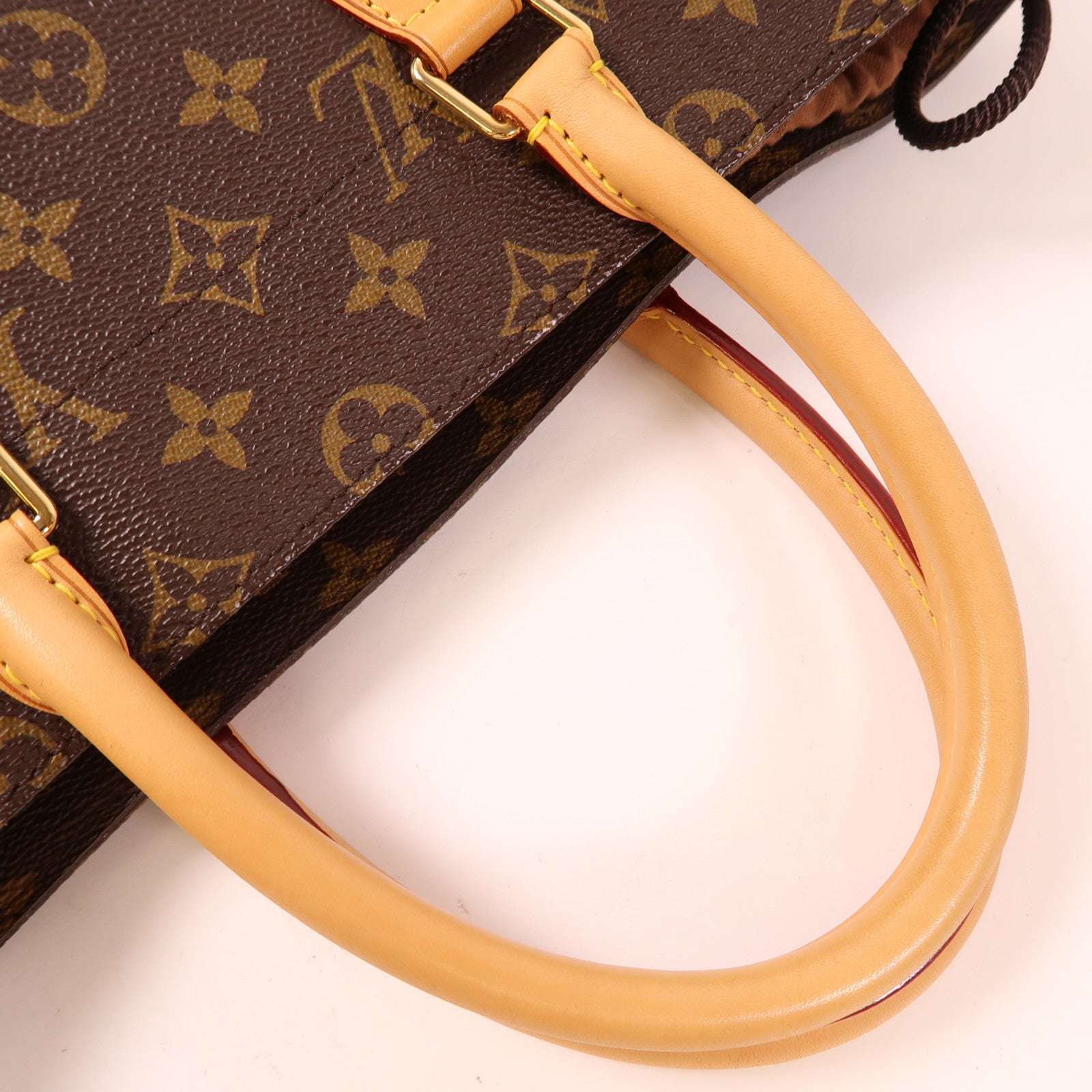 LOUIS VUITTON Monogram Bag With Holes金扣手挽袋