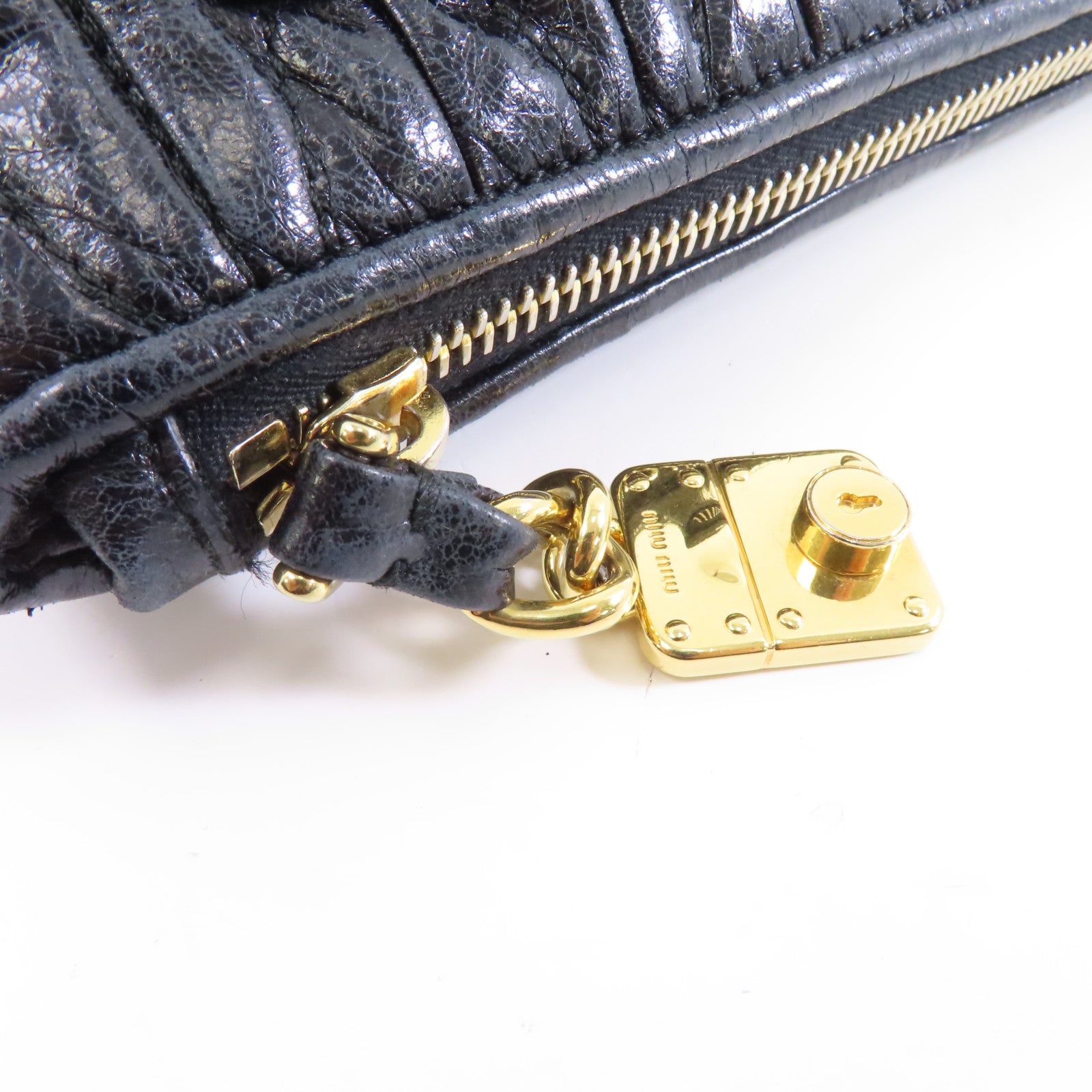 Miu Miu 牛皮皮革Clutch Bag金扣手拿包黑色