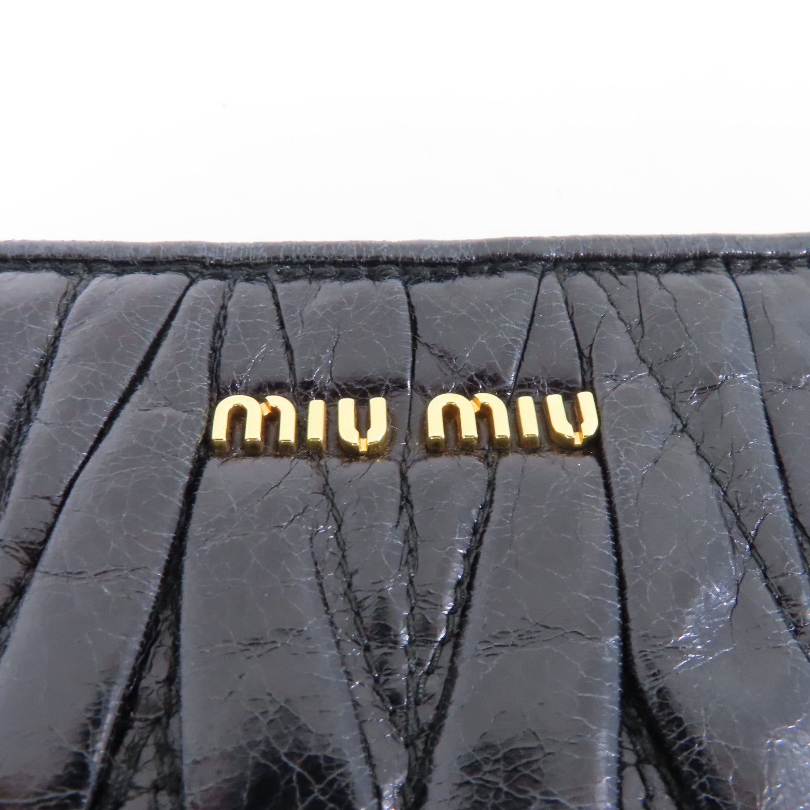 Miu Miu 牛皮皮革Clutch Bag金扣手拿包黑色