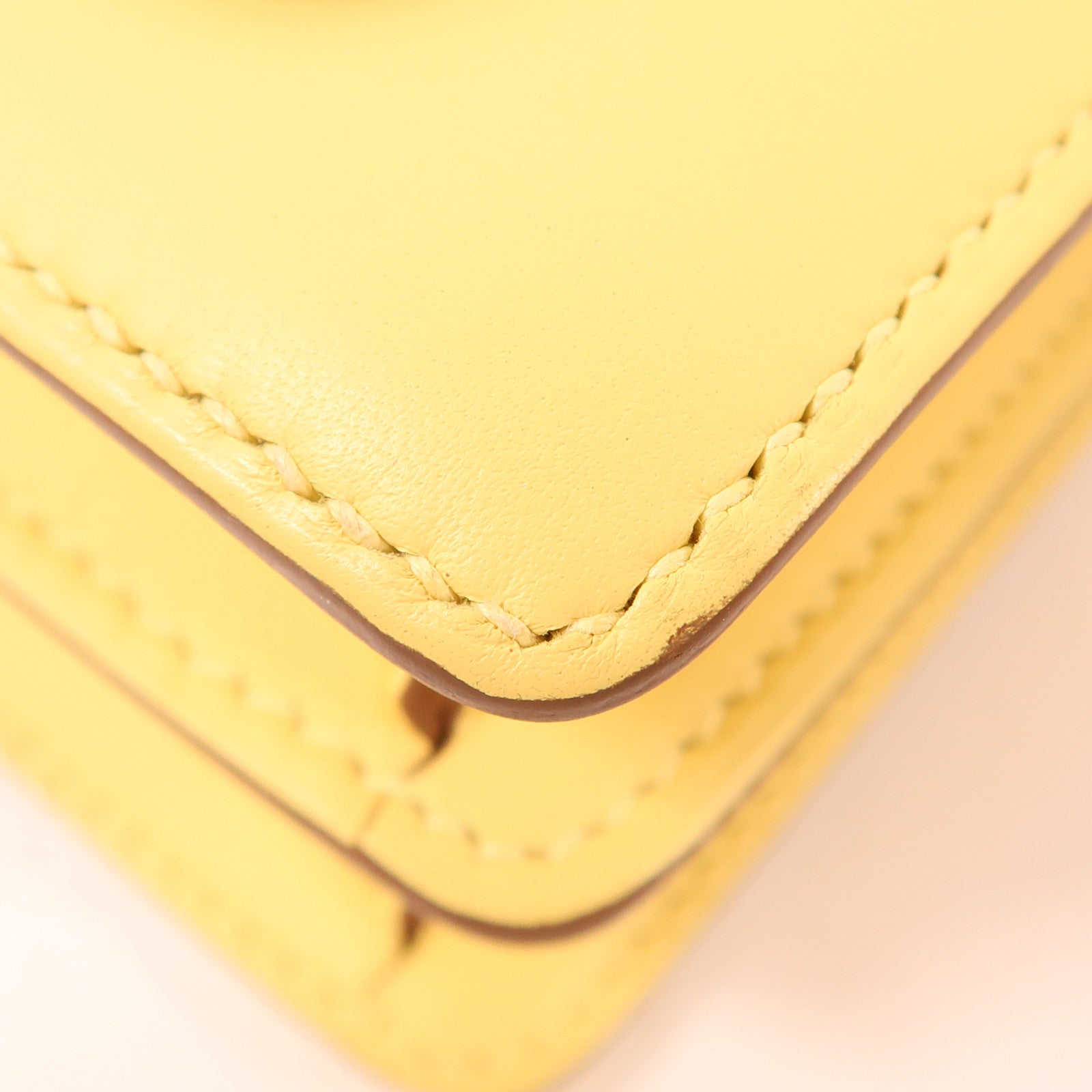 HERMES Swift皮革Mini Roulis金扣手挽袋Yellow
