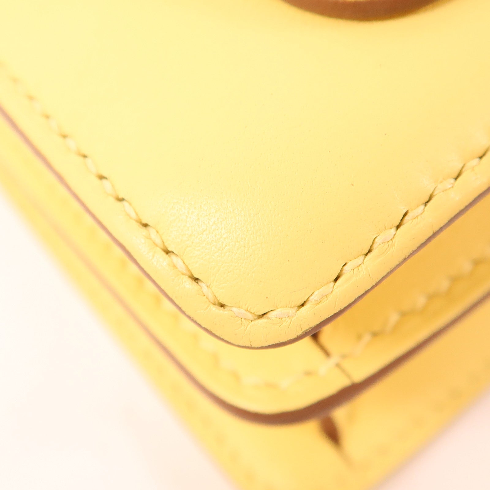 HERMES Swift皮革Mini Roulis金扣手挽袋Yellow