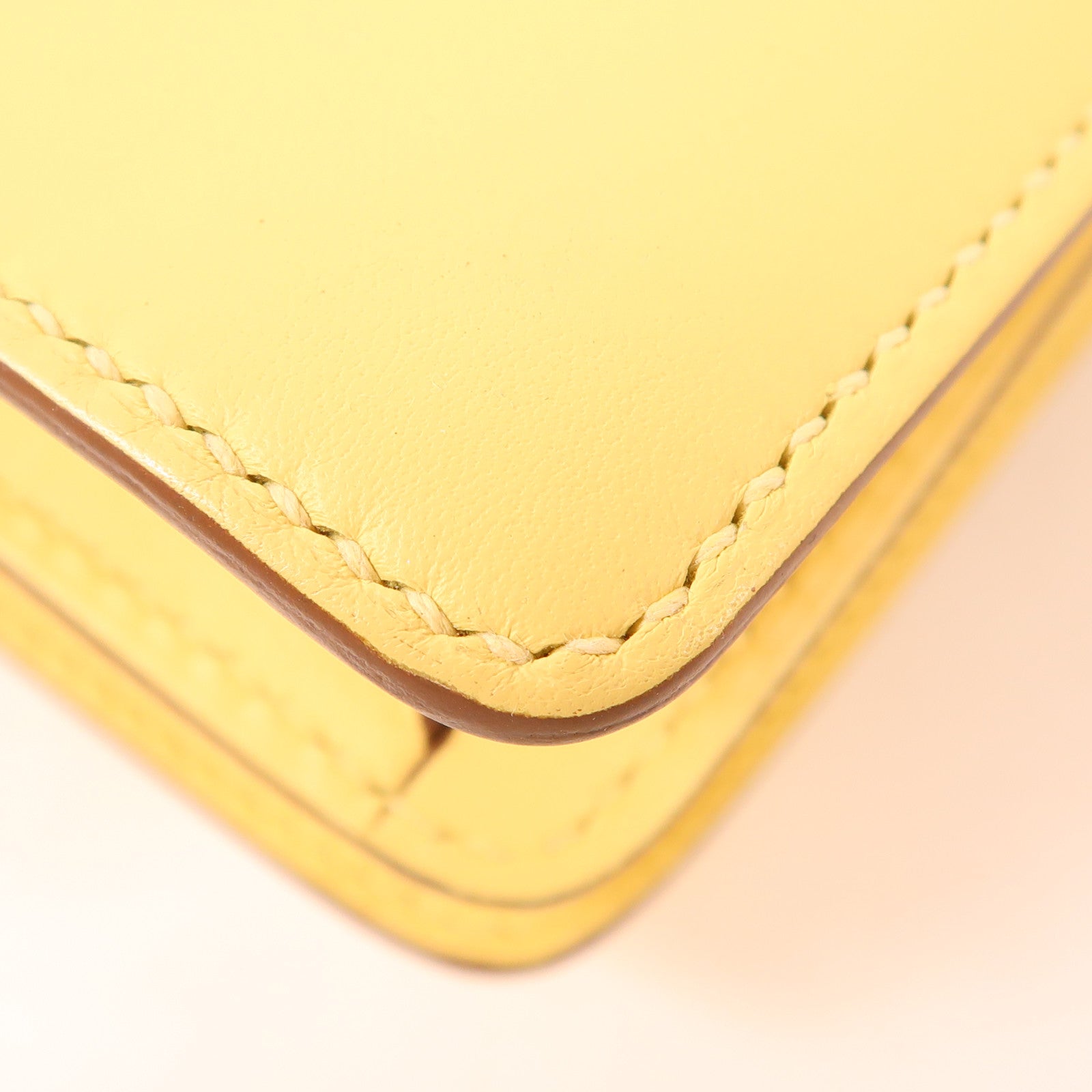 HERMES Swift皮革Mini Roulis金扣手挽袋Yellow