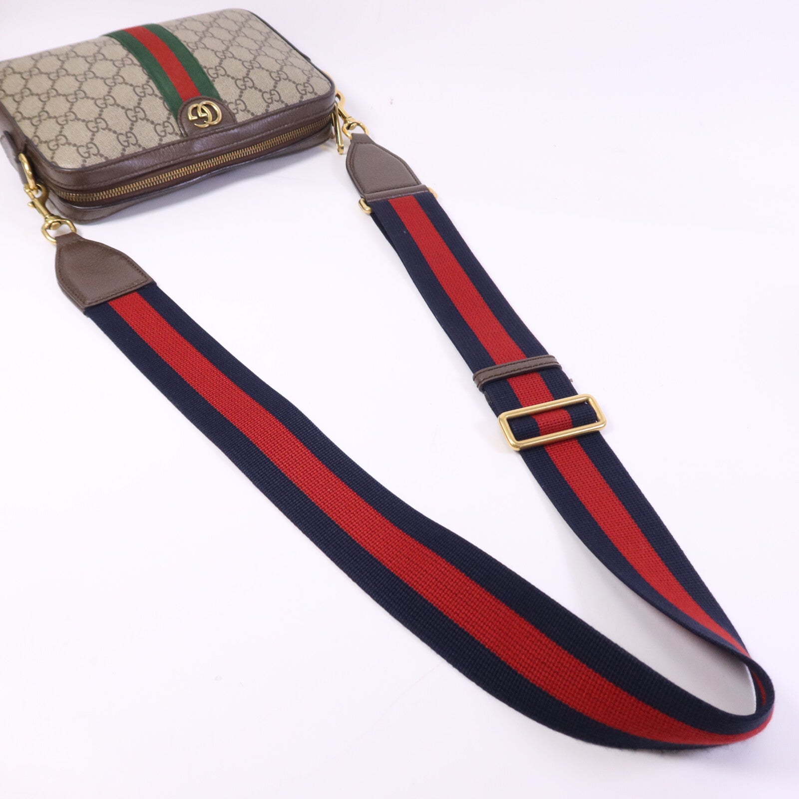 GUCCI 塗層帆布GG Supreme Wristlet Crossbody Bag金扣肩背袋