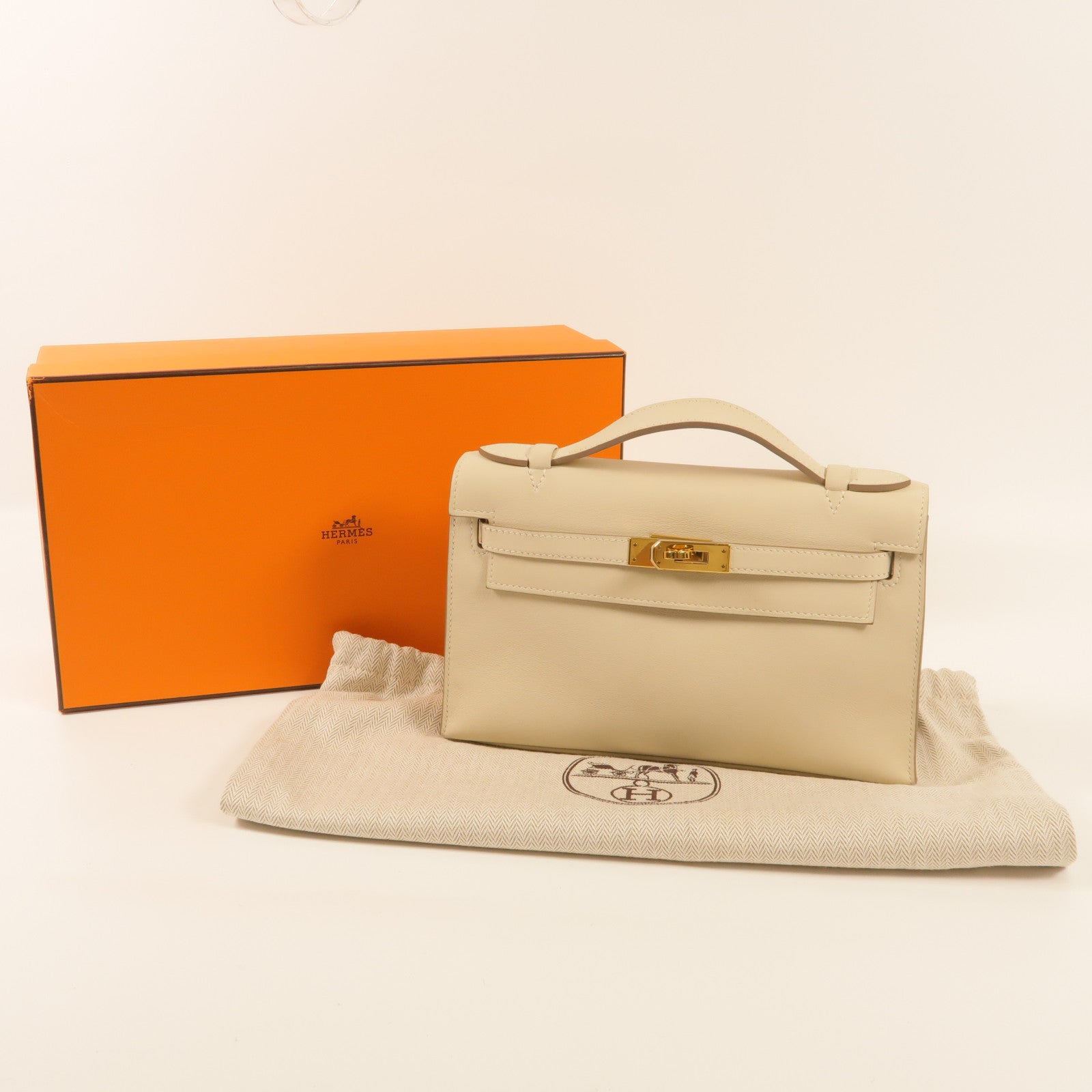 HERMES Swift皮革Pochette Kelly金扣手挽袋Nata