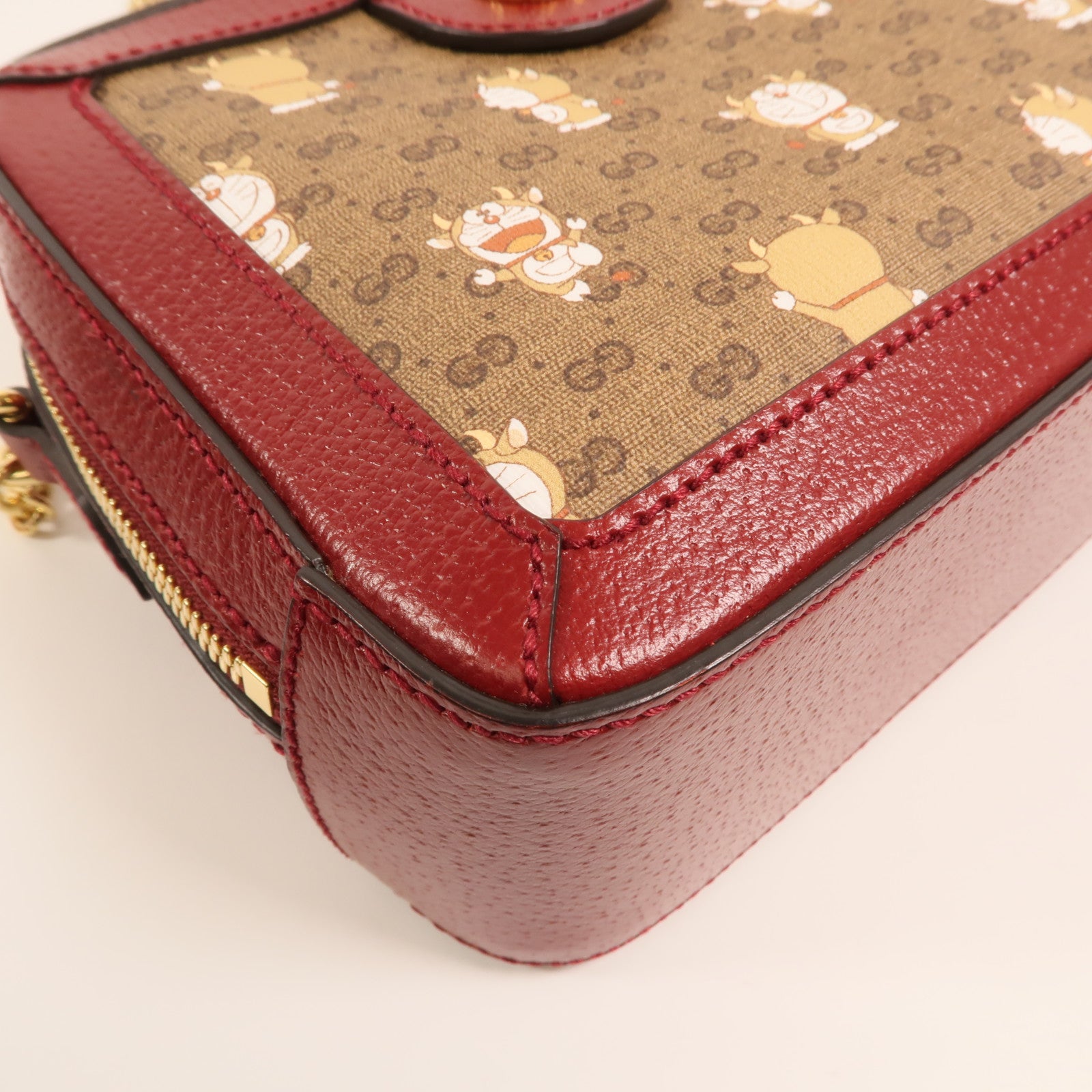 GUCCI 塗層帆布Doraemon Micro GG Supreme鏈帶手挽肩背兩用袋