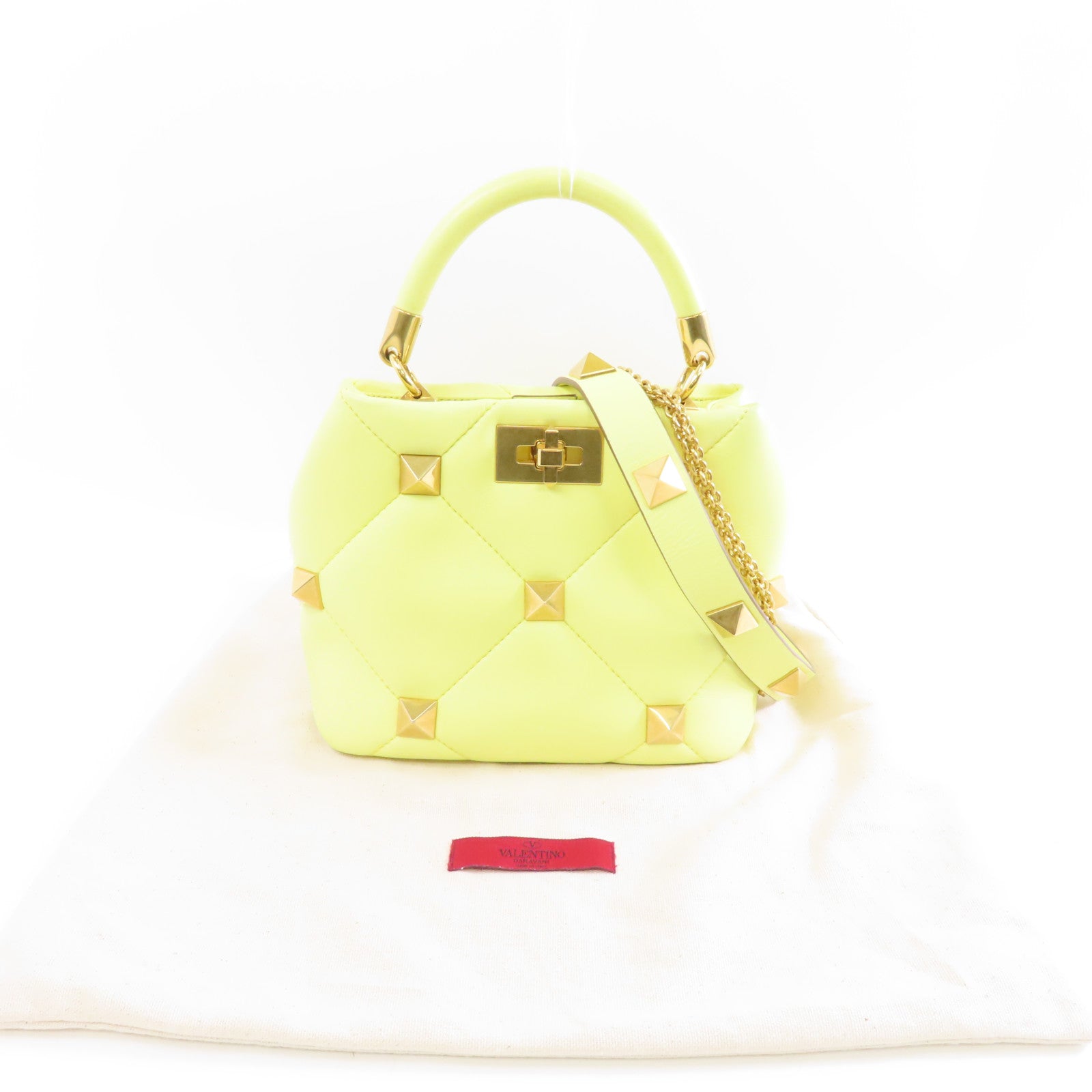 Valentino 牛皮皮革Valentino Garavani Roman Stud金扣手挽肩背兩用袋黃色