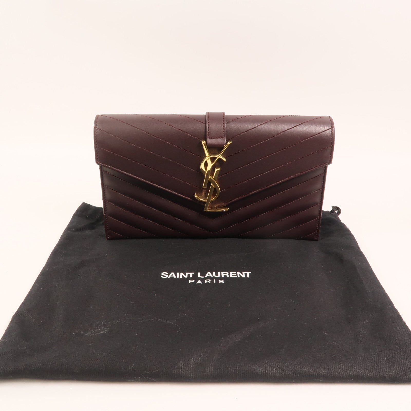 YVES SAINT LAURENT 牛皮皮革Clutch金扣手拿包
