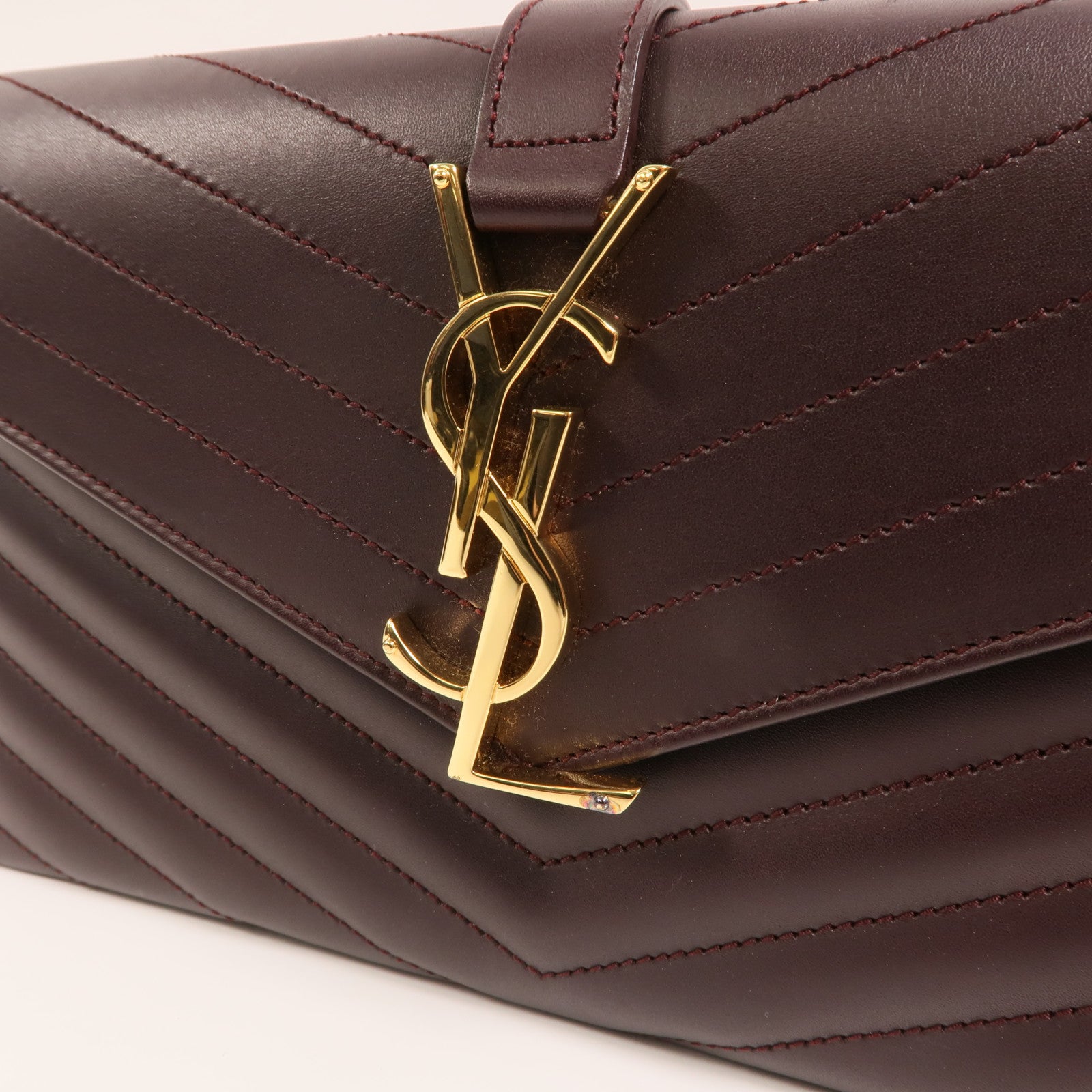 YVES SAINT LAURENT 牛皮皮革Clutch金扣手拿包