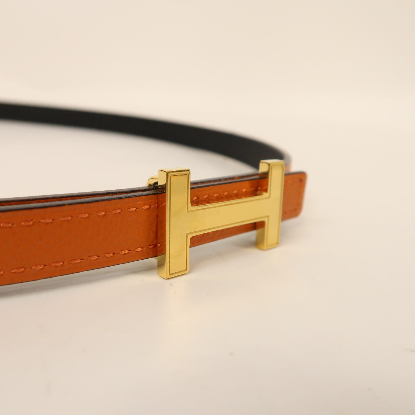 HERMES Epsom皮革/Swift皮革Mini Constance Belt金扣皮帶黑色/橙色