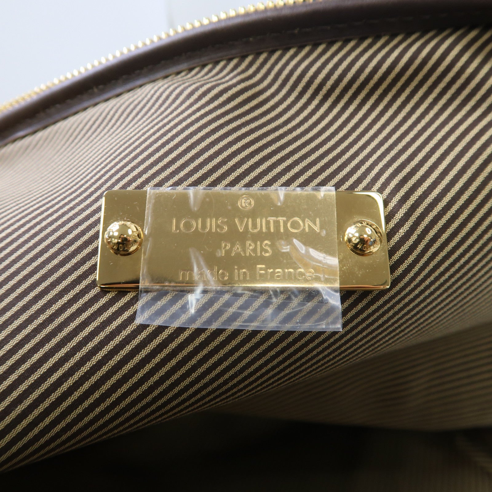 LOUIS VUITTON 皮革Bequia Trotter GM金扣手挽袋啡色