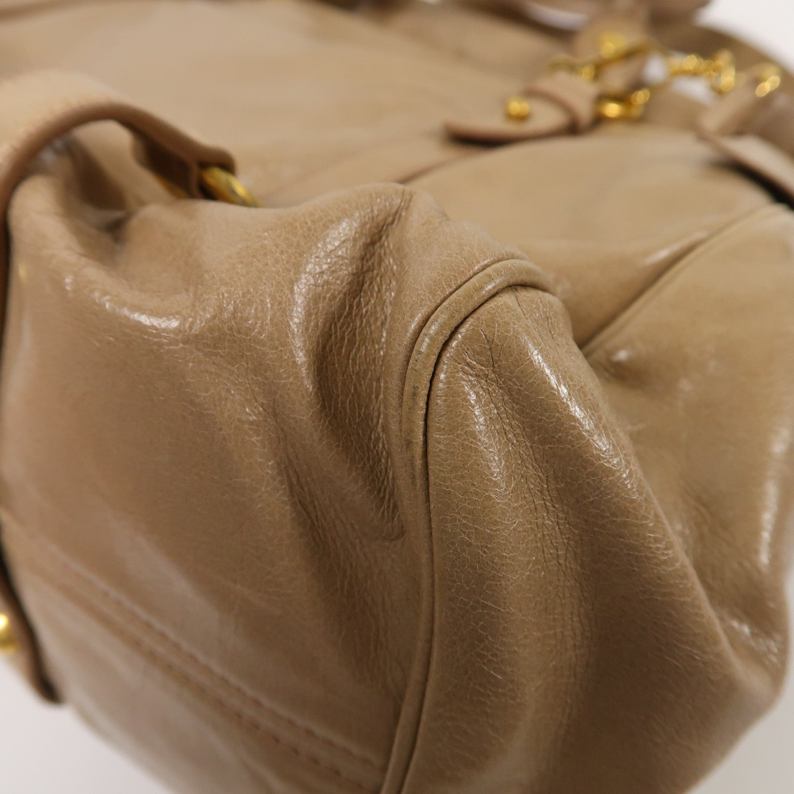 Miu Miu 牛皮皮革Vitello Lux金扣肩背袋棕色