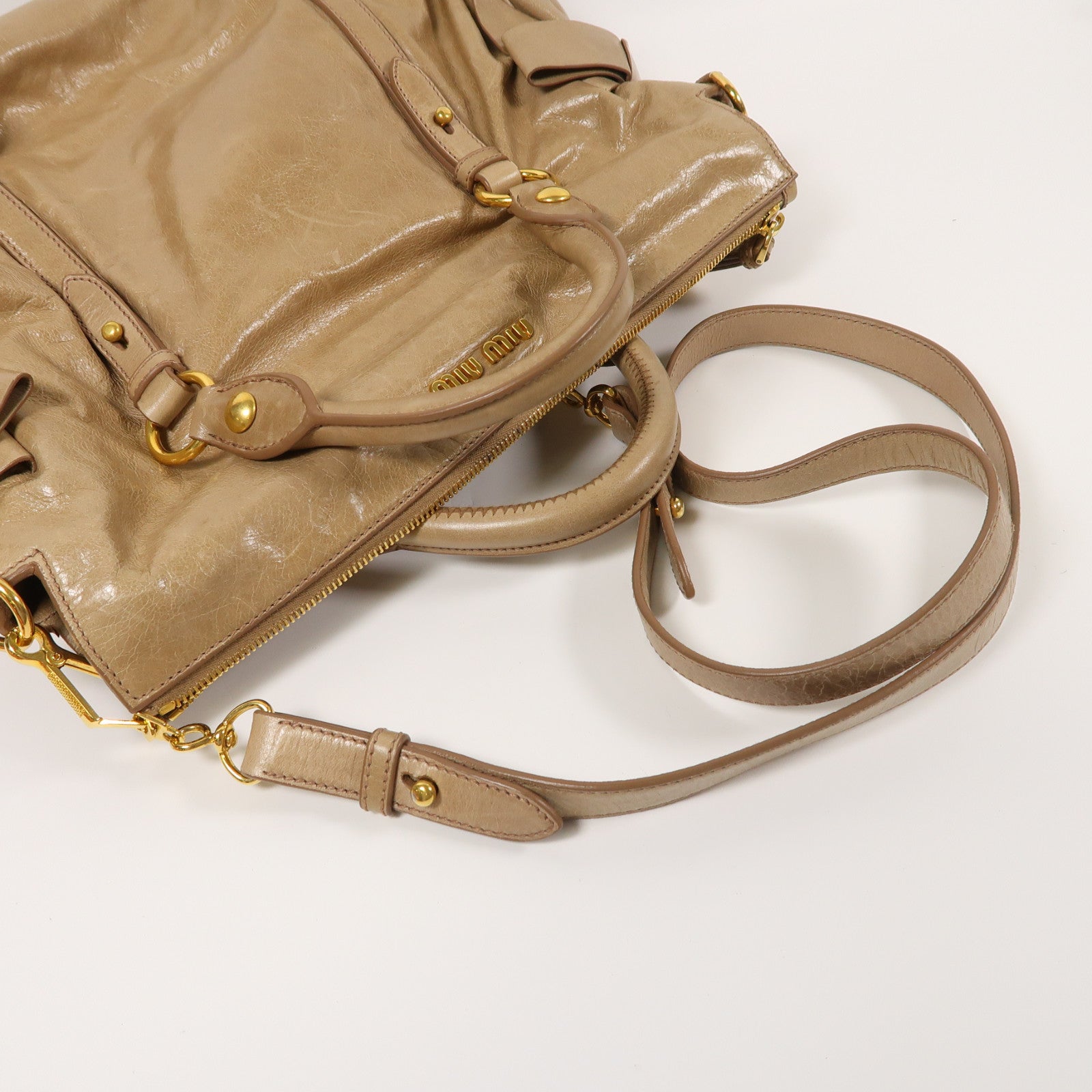 Miu Miu 牛皮皮革Vitello Lux金扣肩背袋棕色