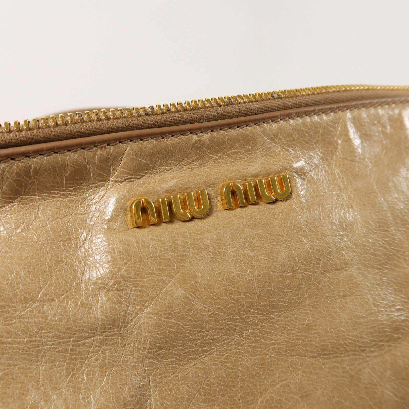 Miu Miu 牛皮皮革Vitello Lux金扣肩背袋棕色