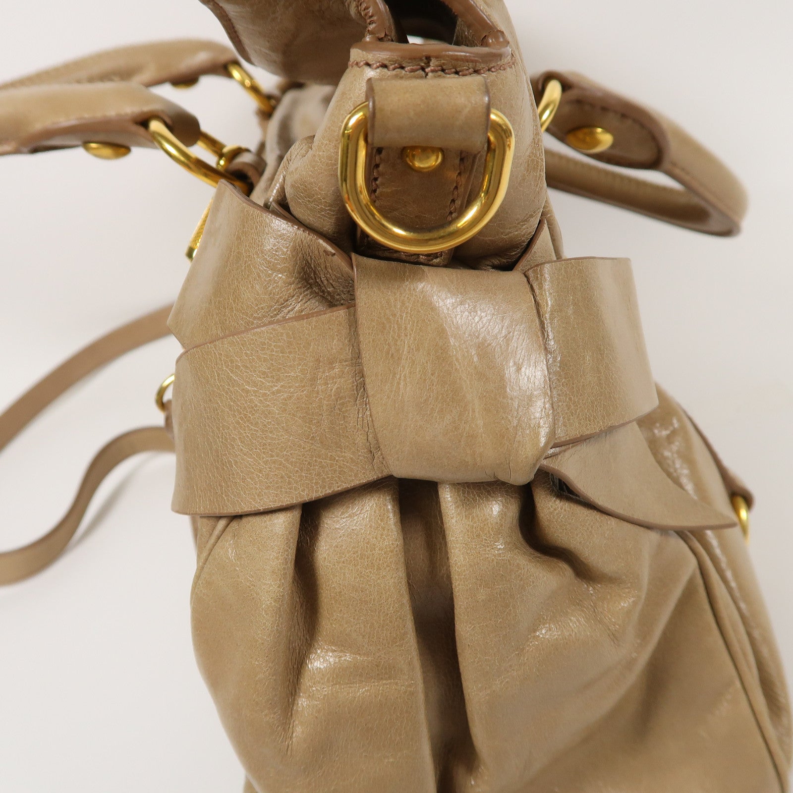 Miu Miu 牛皮皮革Vitello Lux金扣肩背袋棕色