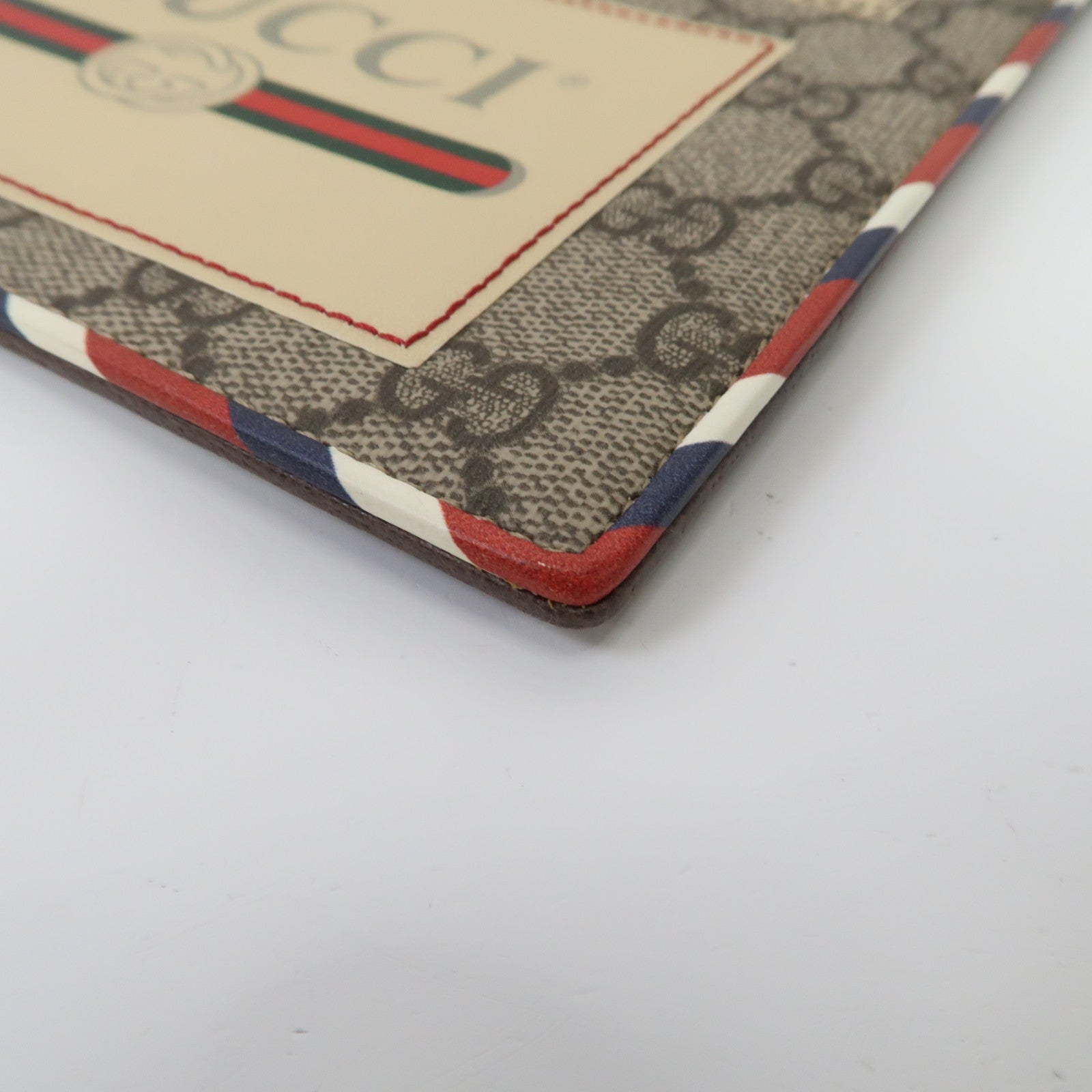 GUCCI 塗層帆布GG Supreme Clutch Bag金扣手拿包啡色