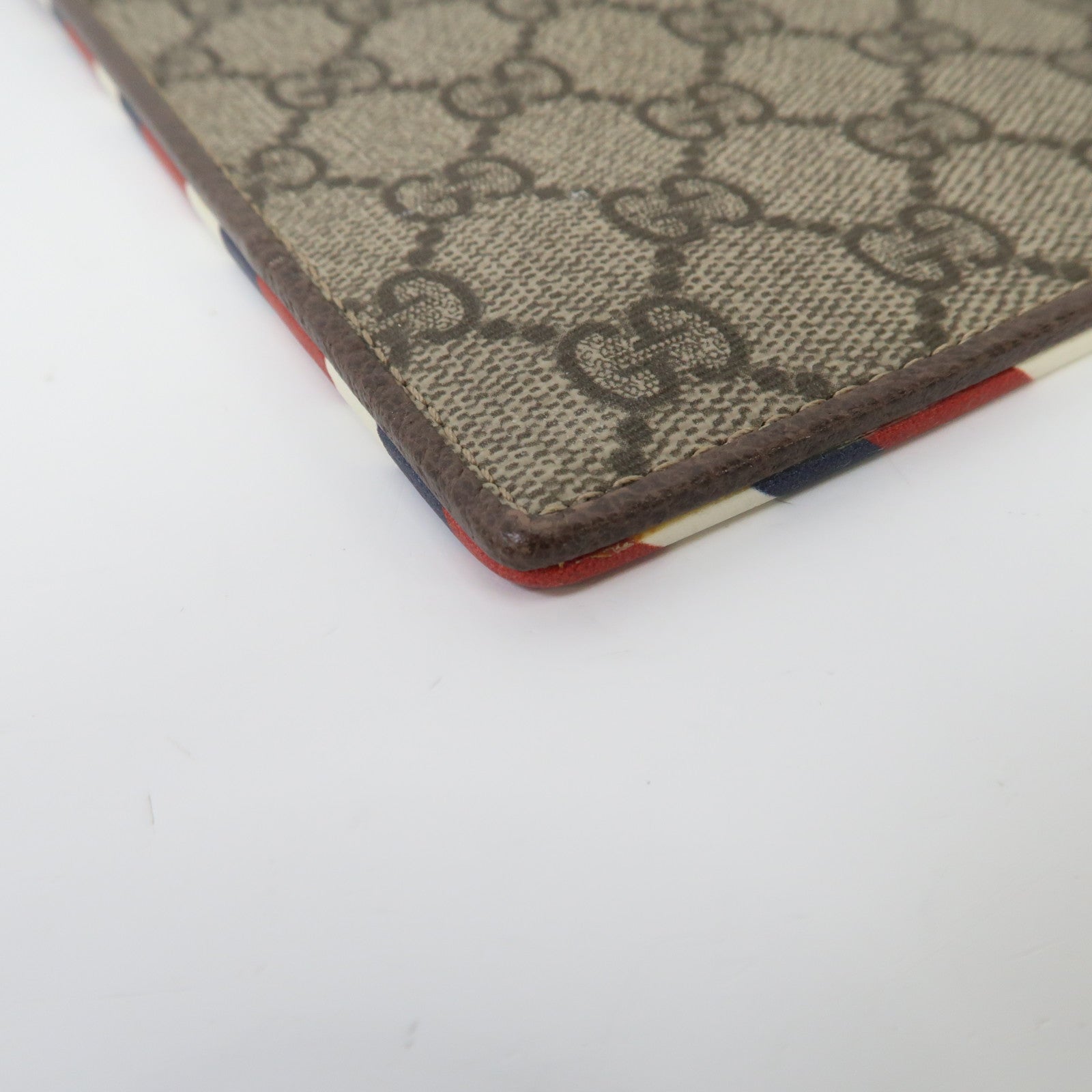GUCCI 塗層帆布GG Supreme Clutch Bag金扣手拿包啡色
